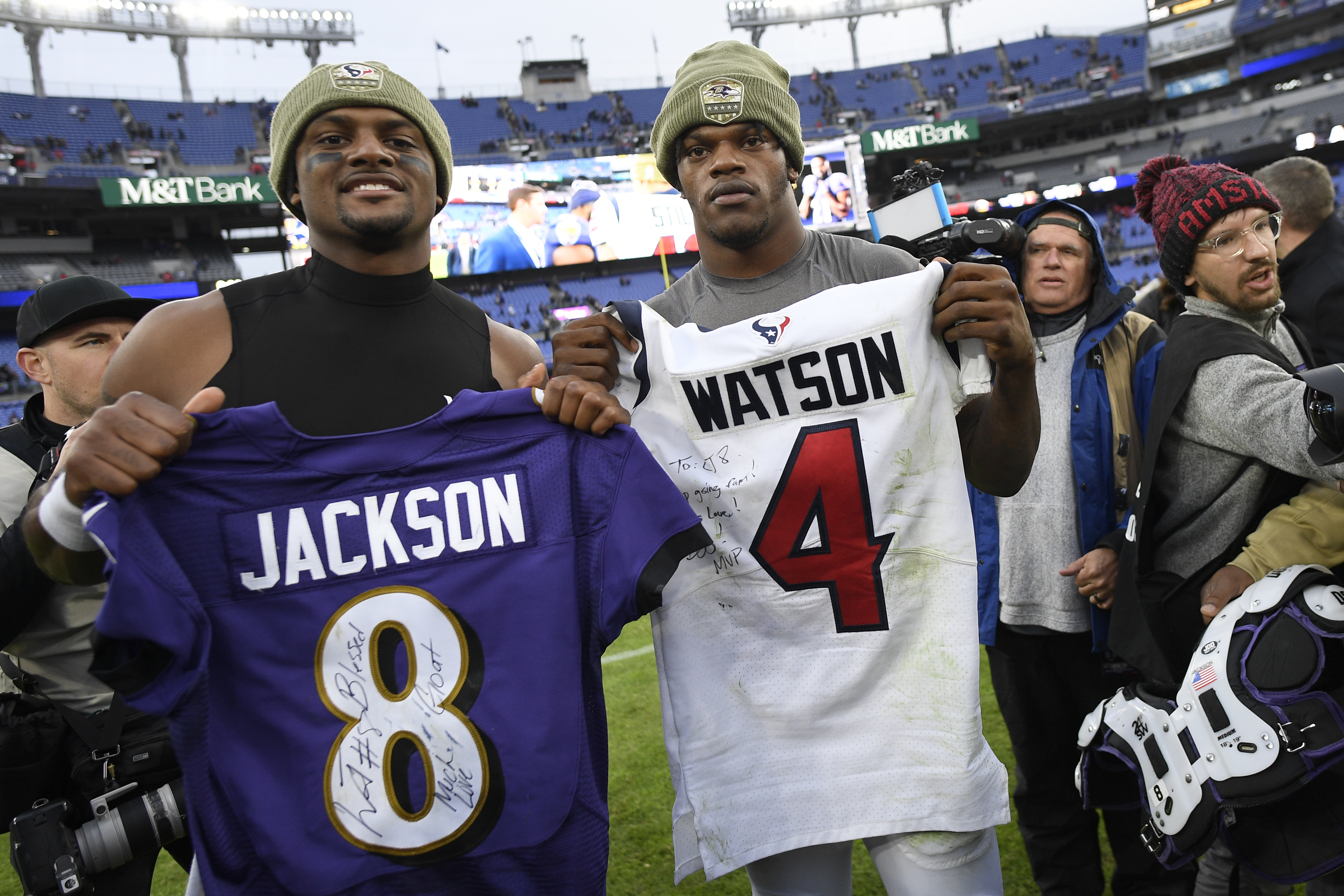 Jersey swaps like the one seen here between Texans quarterback Deshaun Watson (left) and Ravens quarterback Lamar Jackson won't happen this season under the NFL's new coronavirus protocols.