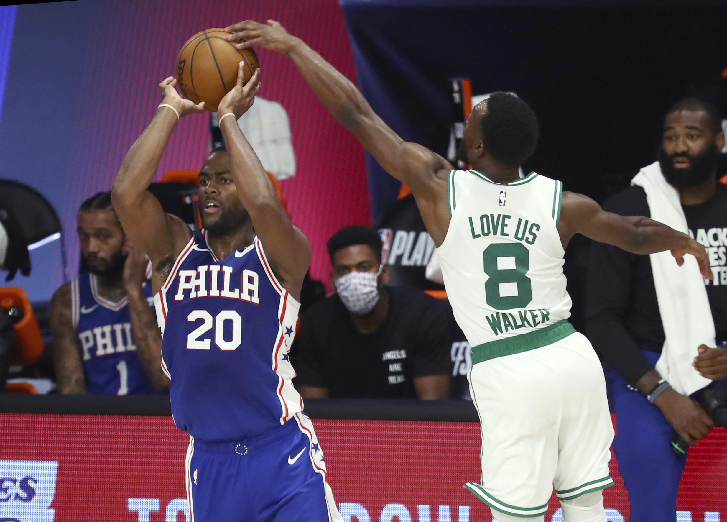 Kemba Walker defends against Philadelphia's Alec Burks in the fourth quarter of Sunday's game.