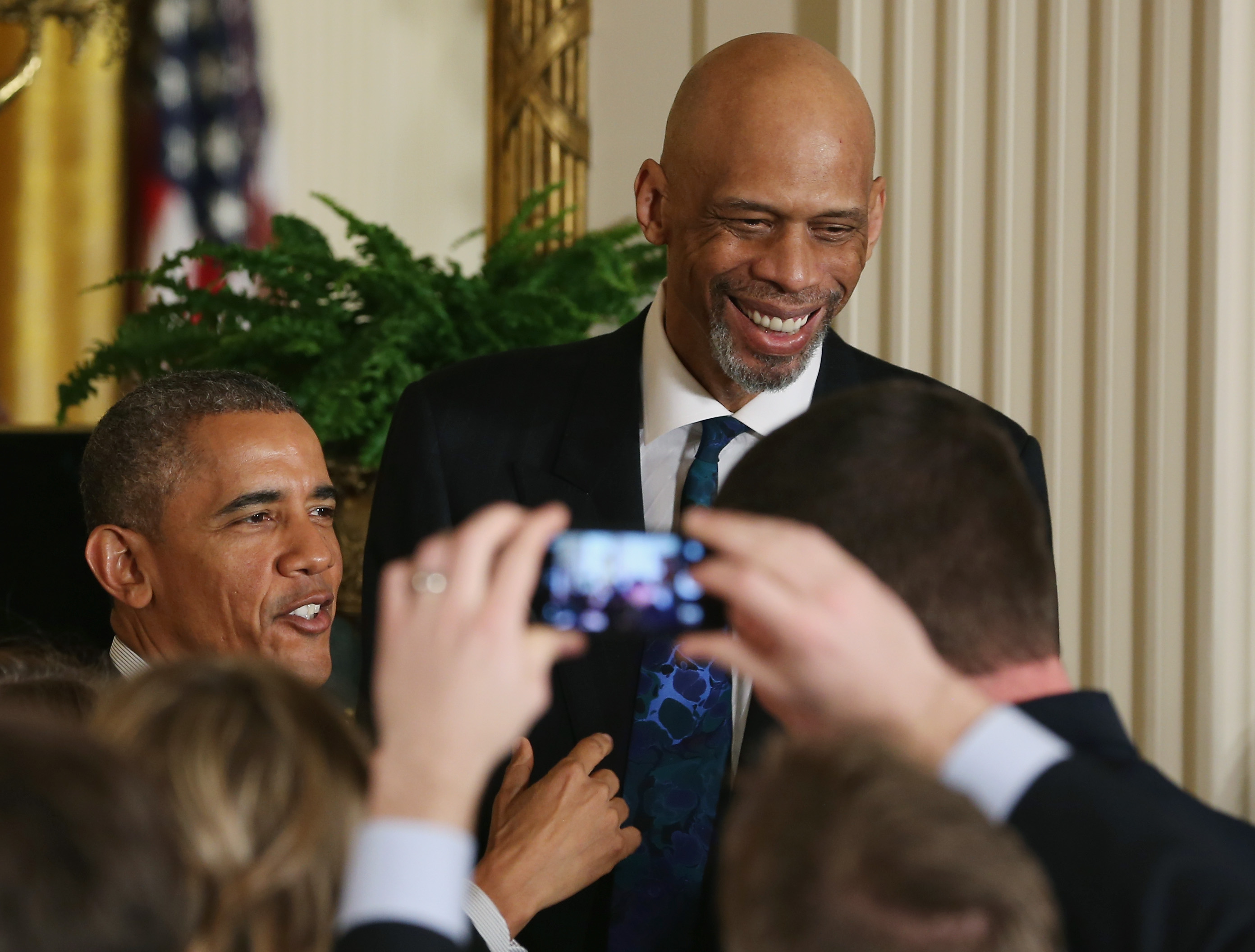 Kareem Abdul-Jabbar stands with President Barack Obama during a 2015 event at the White House.