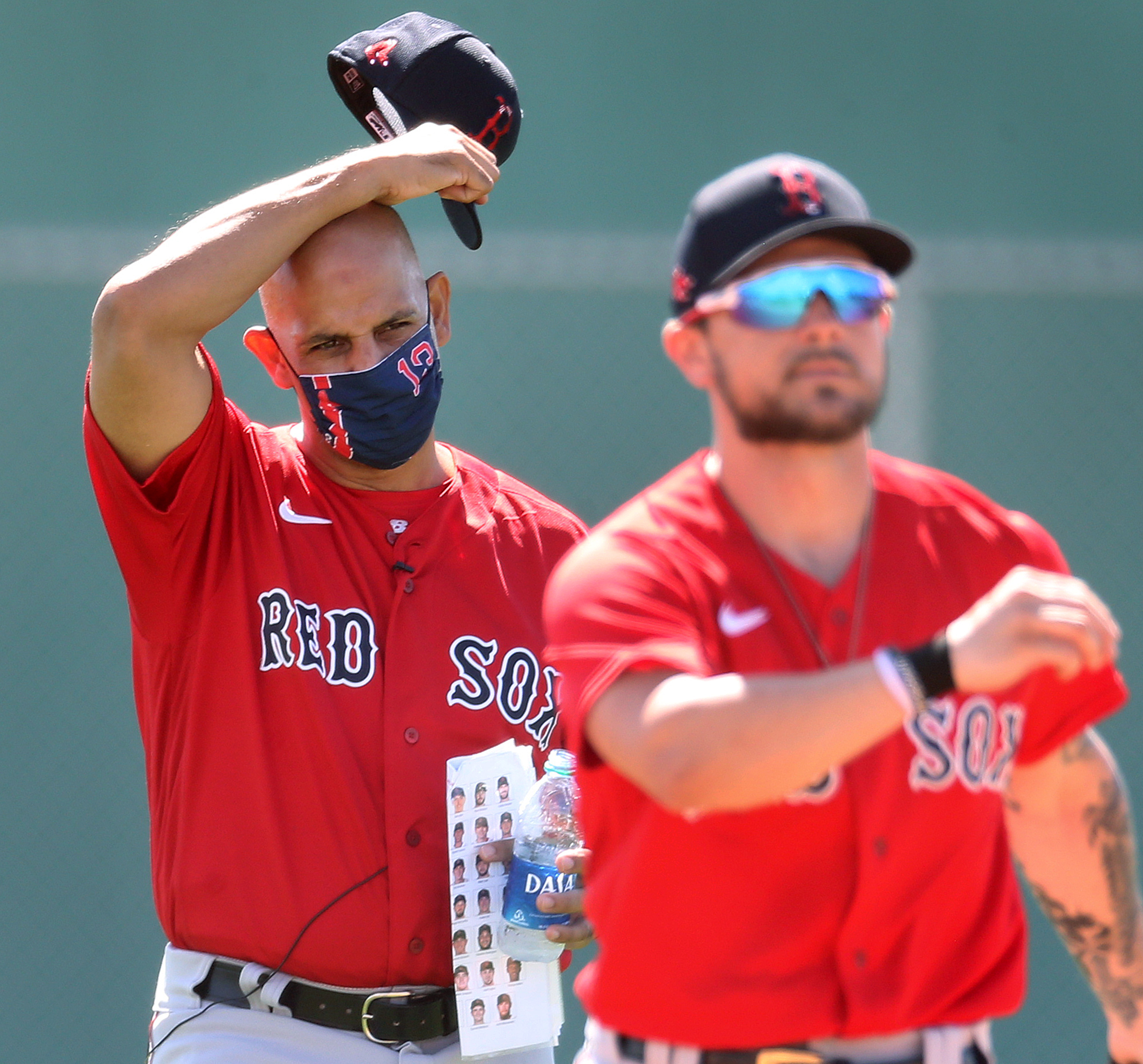 It seemed that even manager Alex Cora (left) needed a "cheat sheet" to keep track of the many new Red Sox players.
