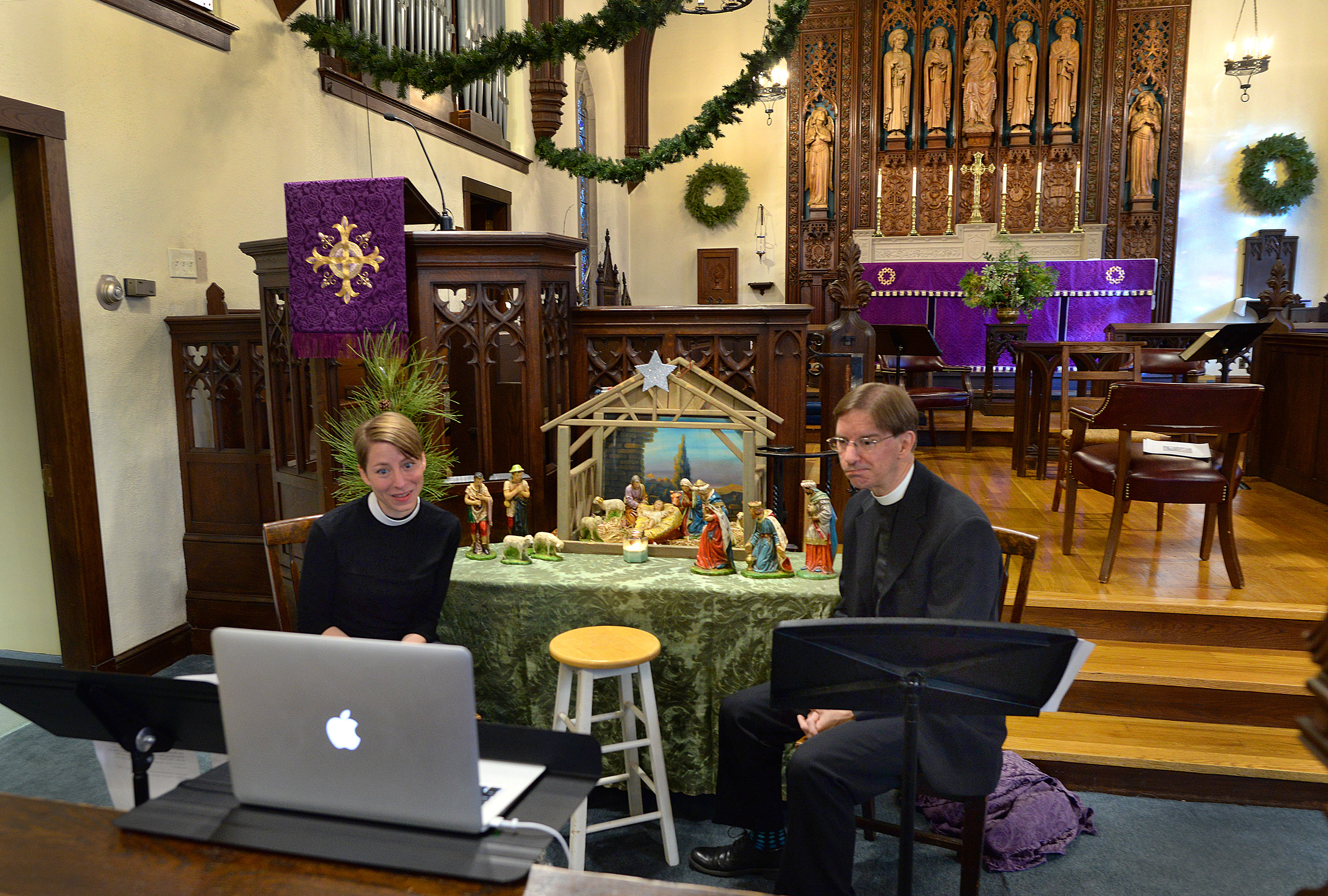 A taping of the Nativity story was held at Saint John the Evangelist Church in Hingham for its online service to be broadcast for the children of the congregation. The Rev. Jacqueline A. Clark (left) and the Rev. Timothy E. Schenck spoke about the Nativity in front of the altar during a Sunday service.
