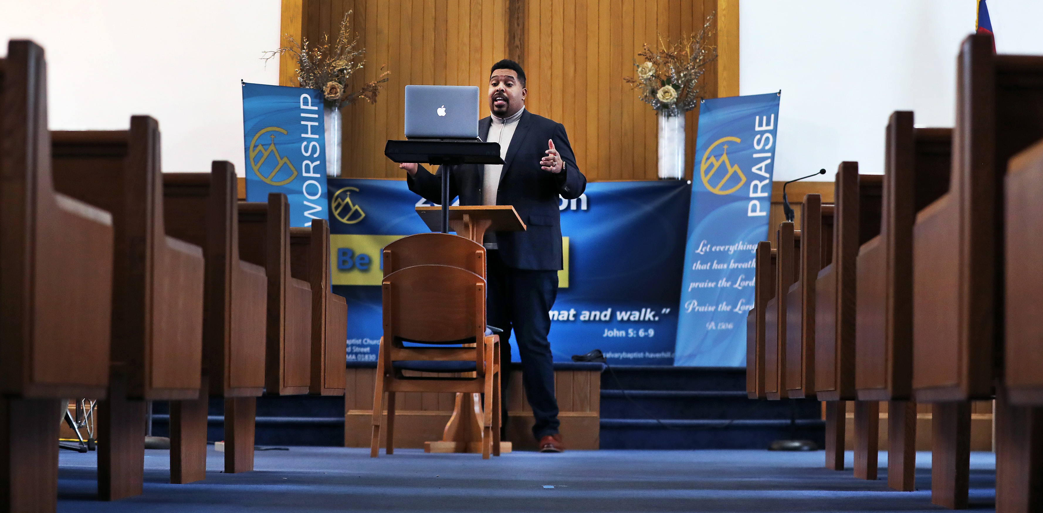 The Rev. Kenneth Young of the Calvary Baptist Church in Haverhill records an introduction to his Sunday sermon on a laptop computer inside the empty church. With the COVID-19 pandemic, the church has not held worship services inside since March.
