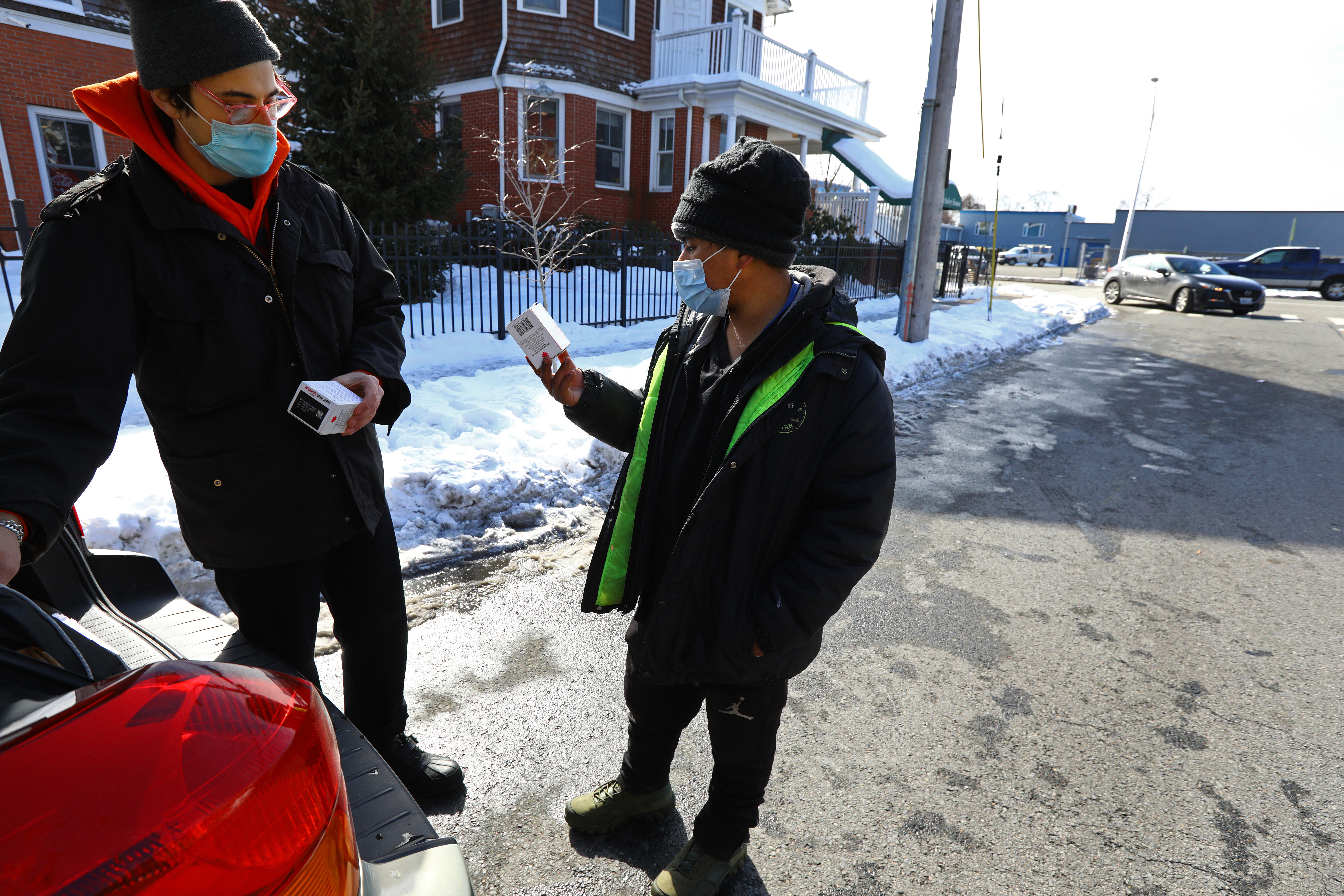 Diego Arene-Morley, left, program manager with Rhode Island Communities for Addiction Recovery Efforts, talked to Cesar Gomez, 22, about saving lives with naloxone.