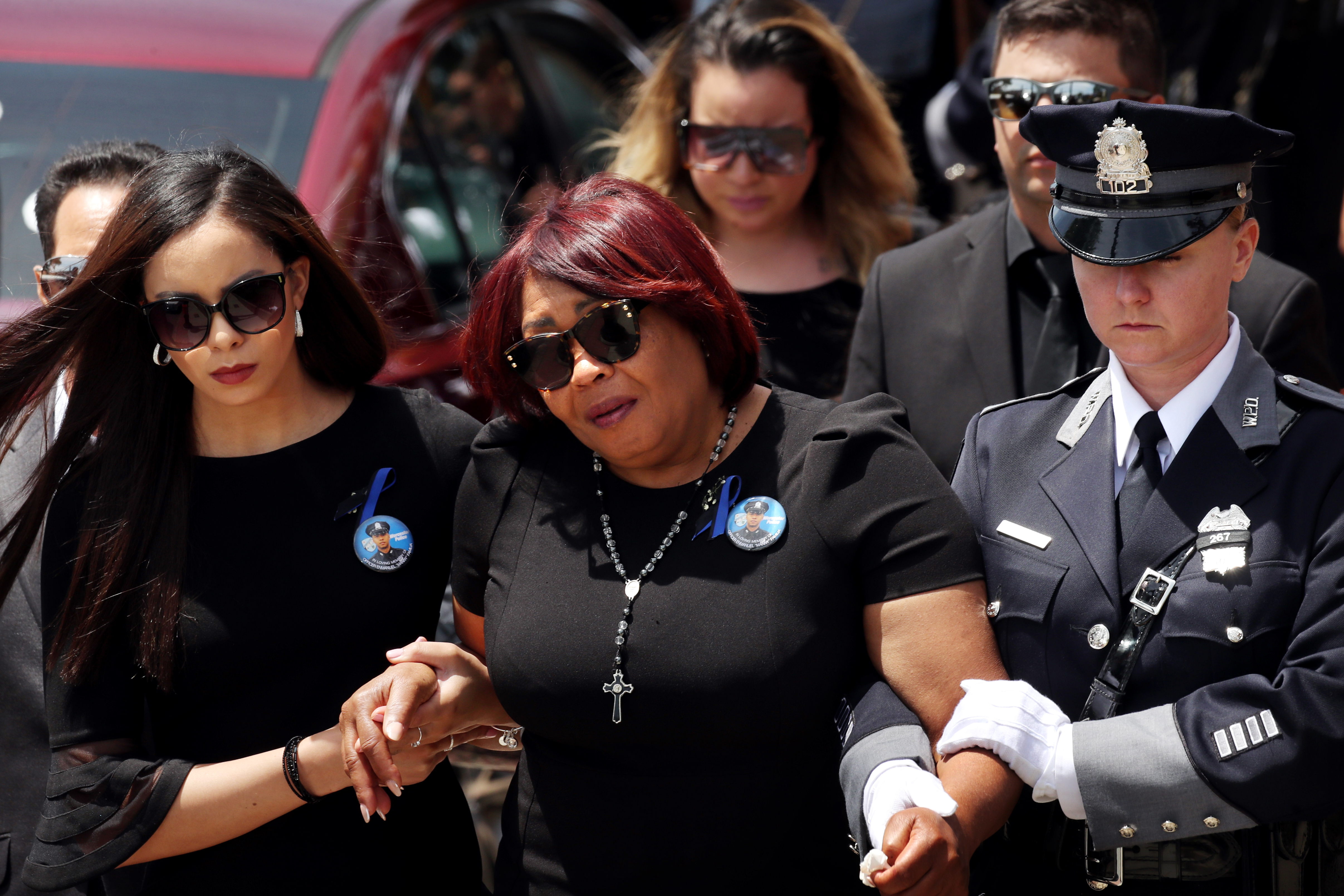 Family and friends departed a funeral service for Worcester Police Officer Enmanuel "Manny" Familia.