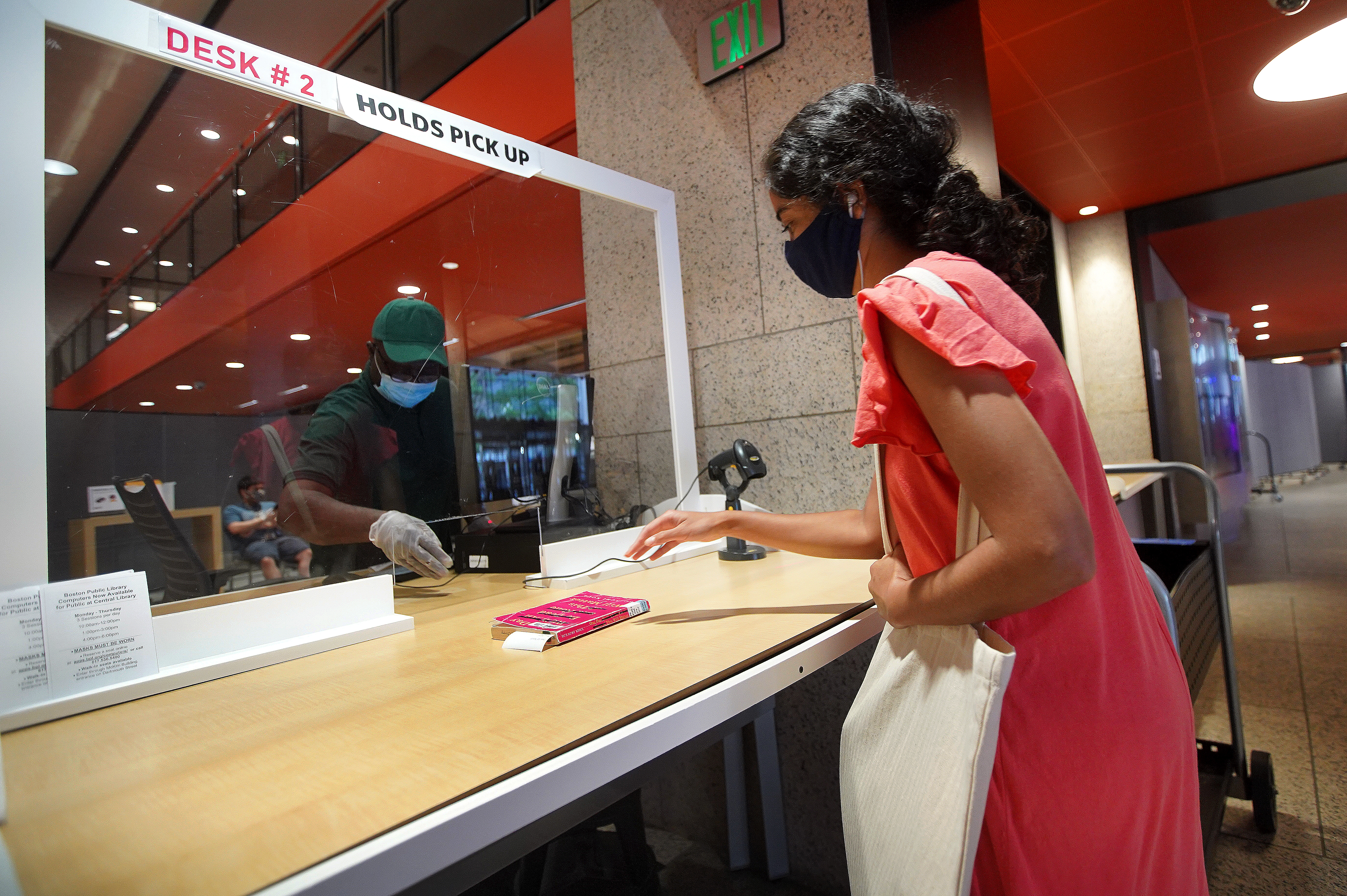 Lisette Desouza picked up a book at the Boston Public Library's Holds and Pick Up window.