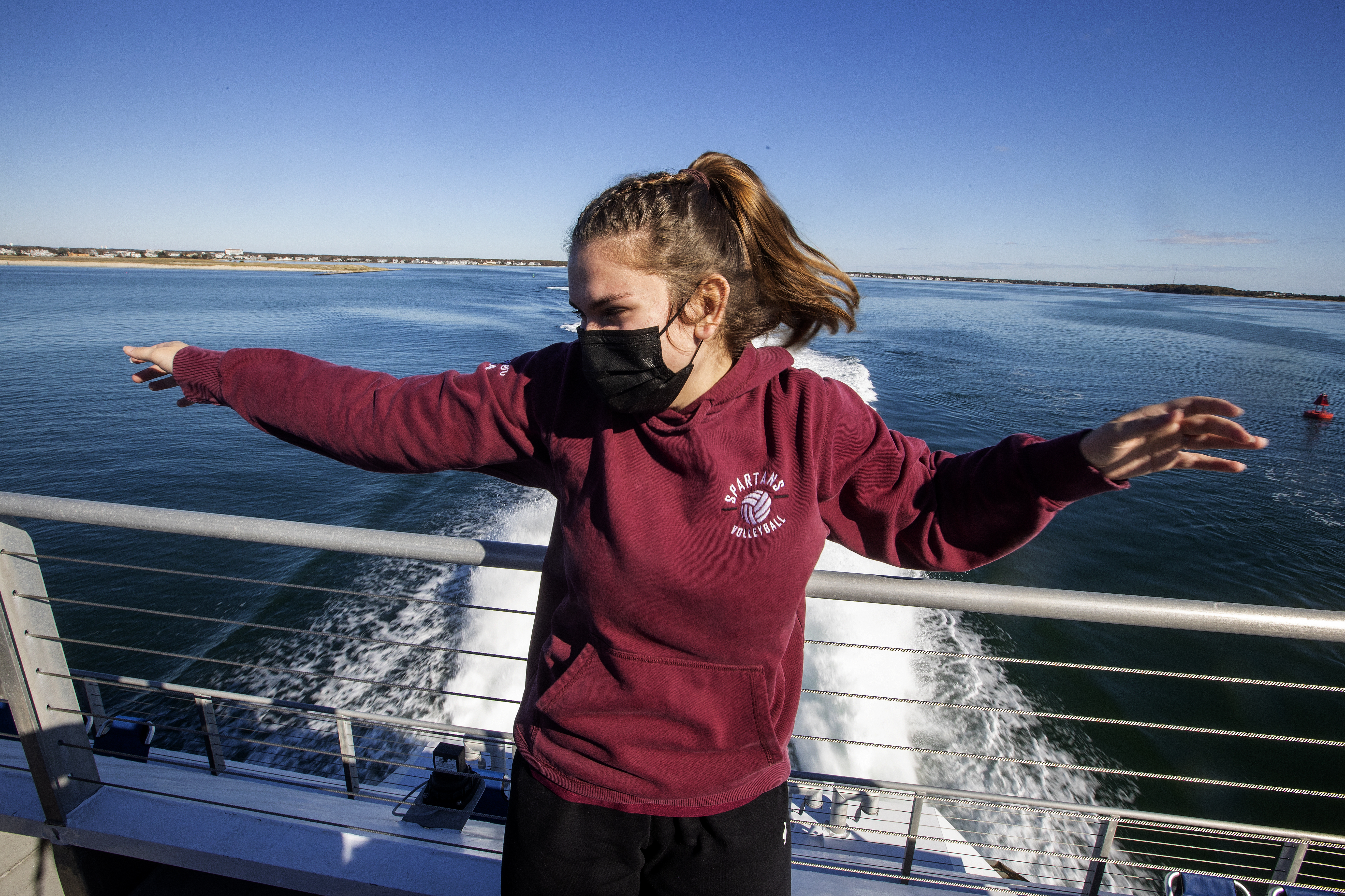 Tori Prevzner poses for pictures on deck on the way to Nantucket.