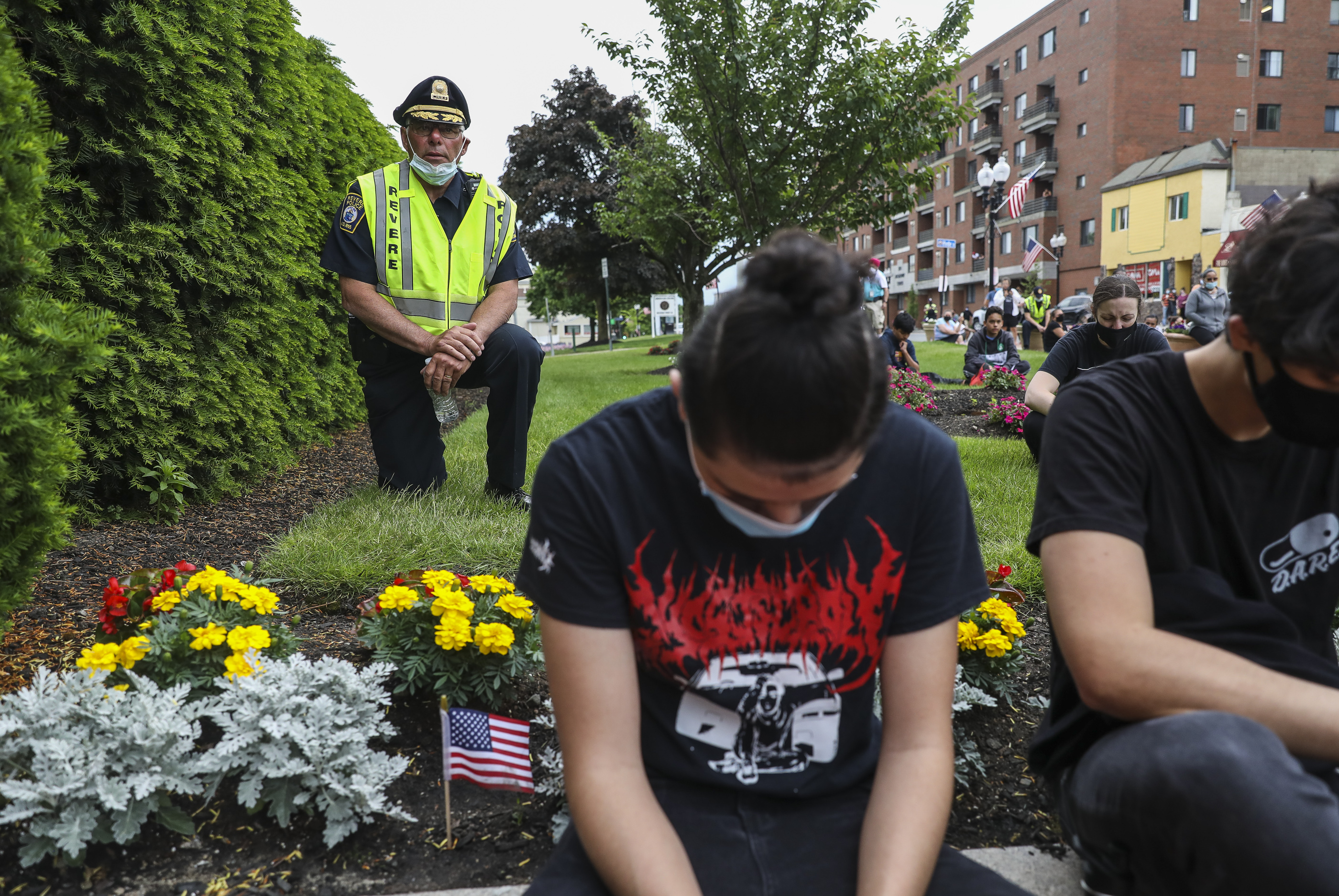 Revere Chief of Police James Guido joined others in taking a knee in front of Revere City Hall for 8 minutes and 46 seconds.