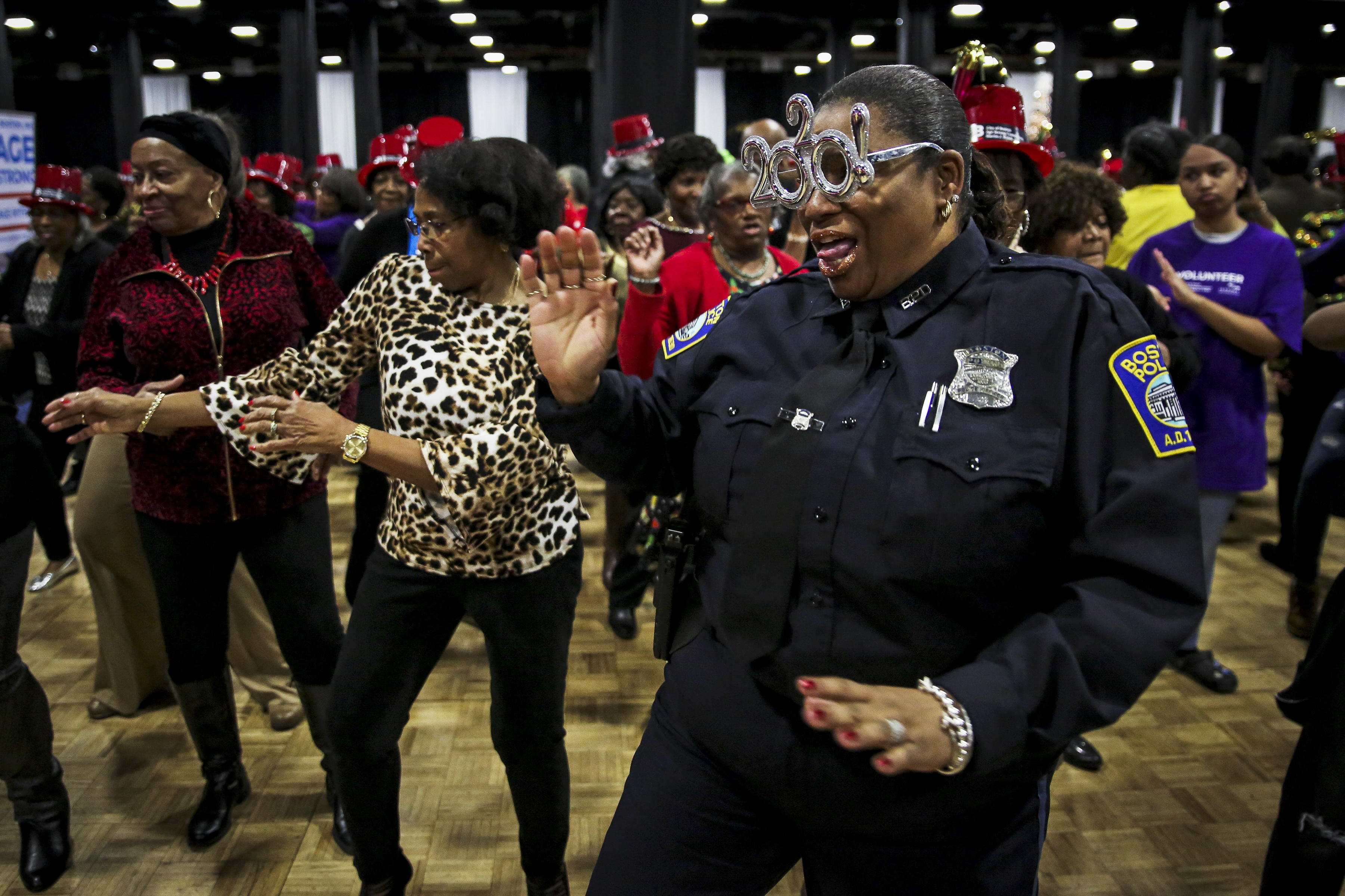 Officer Cynthia Brewington of the Boston Police Department danced at the 31st Annual Senior First Night Celebration at the World Trade Center in Boston on Dec. 30.