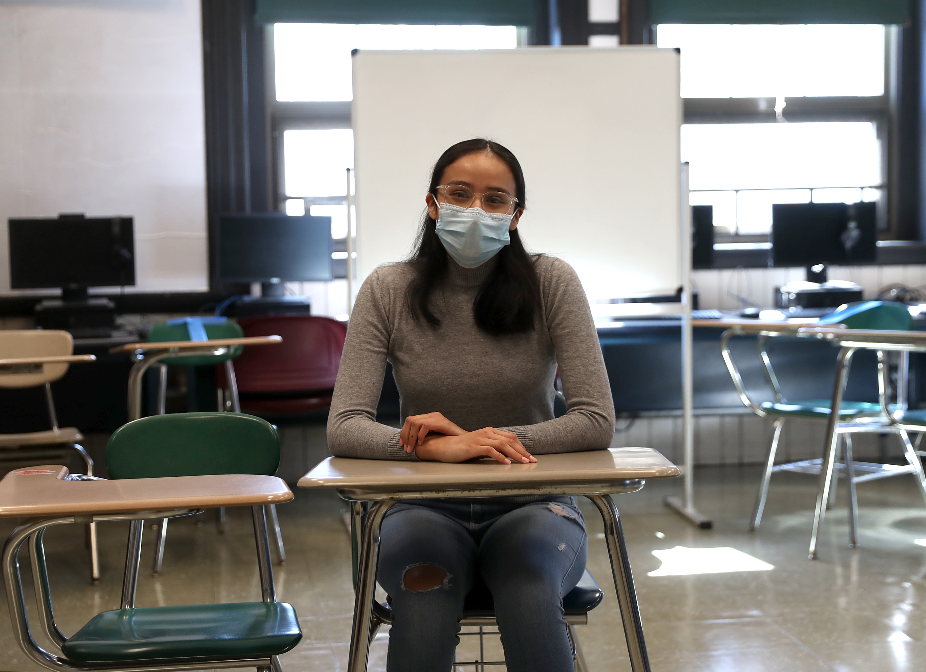 Mariela Miron, a student at the University Park Campus School, sits in the classroom she will soon be attending in person.