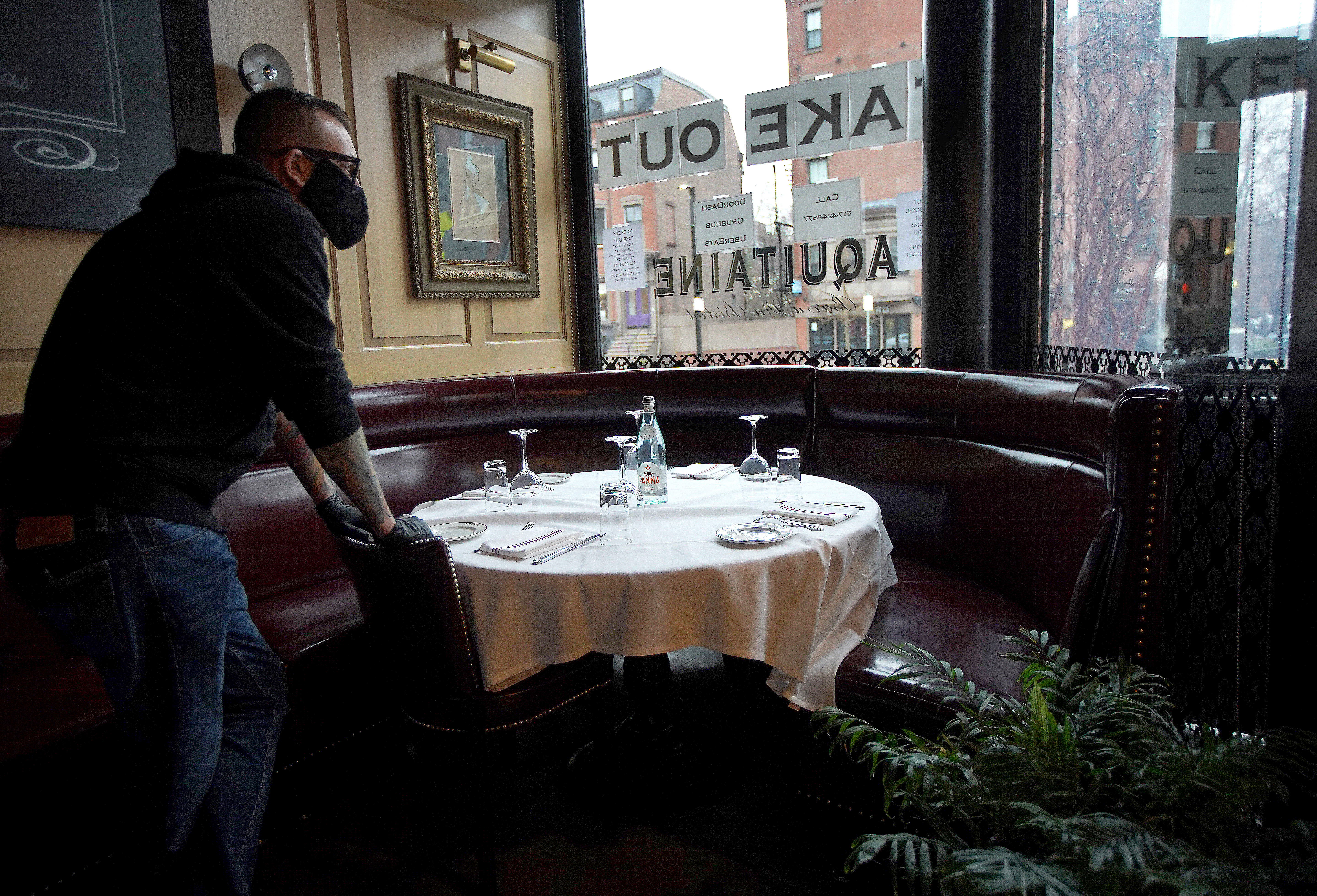 Boston, MA - 4/03/2020  -  Aquitane Restaurant Group Manager Scott Lamb looks out his restaurant's window which now, like all restaurants, offers take-out only due to the COVID-19 Coronavirus.  Photos of Aquitaine restaurant, which is open for take out and delivery.  (Barry Chin/Globe Staff)