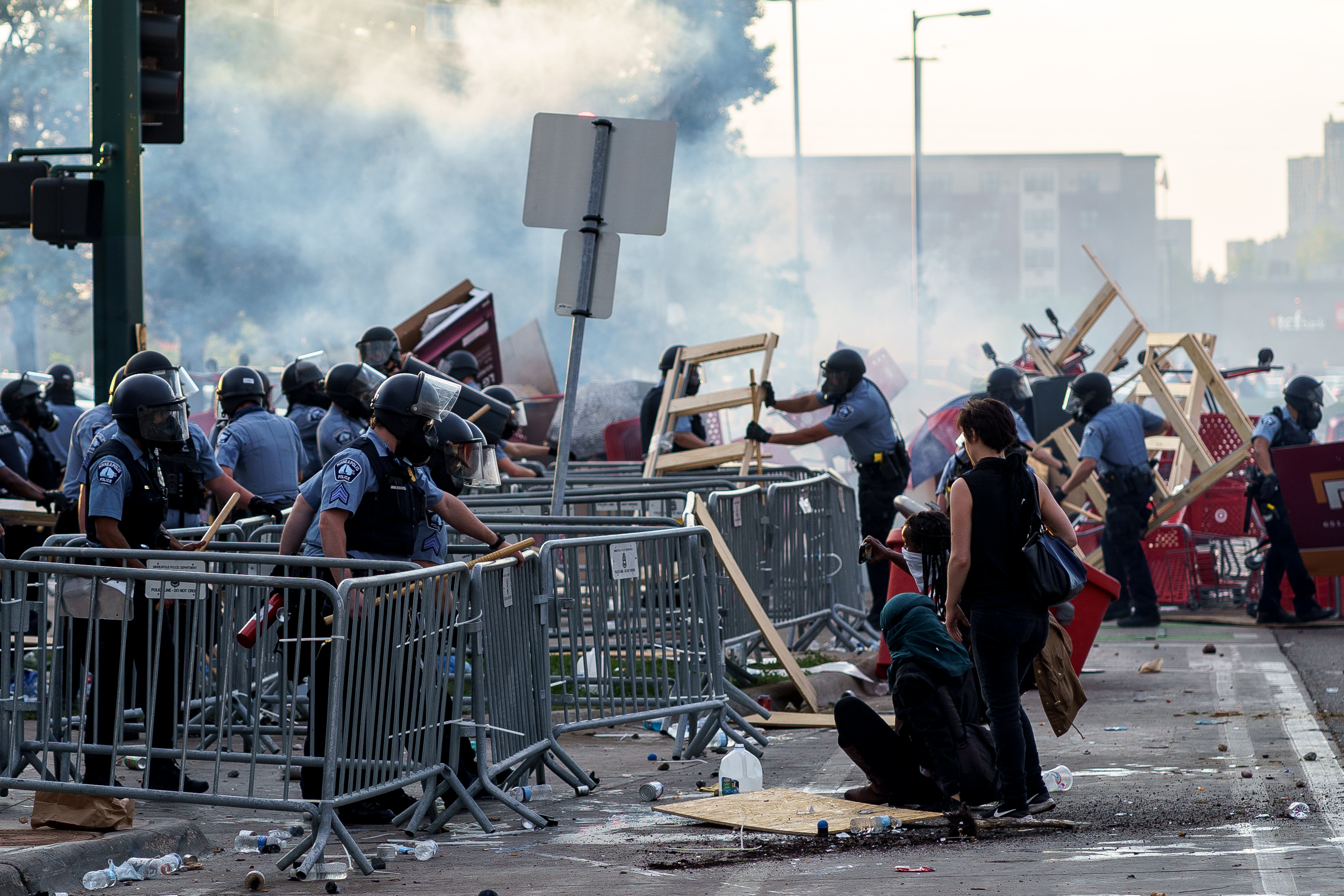 Police removed barricades set by protesters during a demonstration outside the Third Police Precinct.