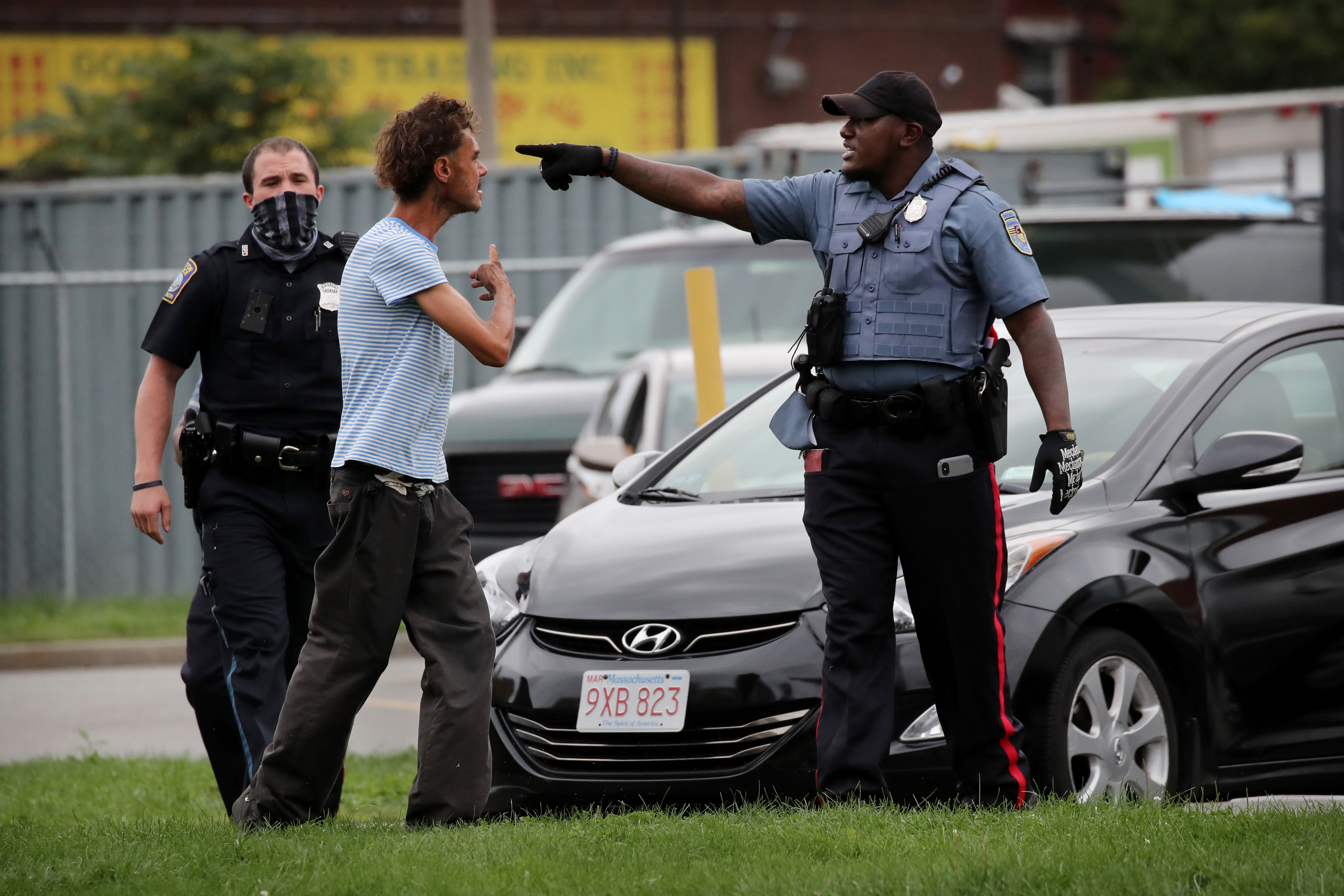 A man exchanged words with officers in a parking lot on Mass. Ave.