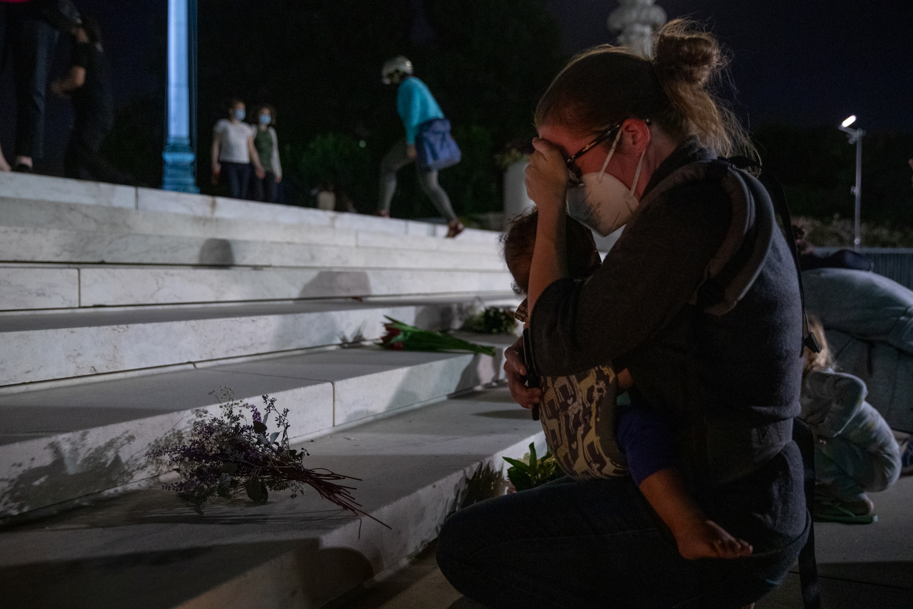 Crowds gathered at the Supreme Court to remember Justice Ruth Bader Ginsburg on Friday night.