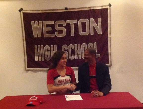 Julimar Avila with her father Julio when she committed to swim at Boston University in November 2014.
