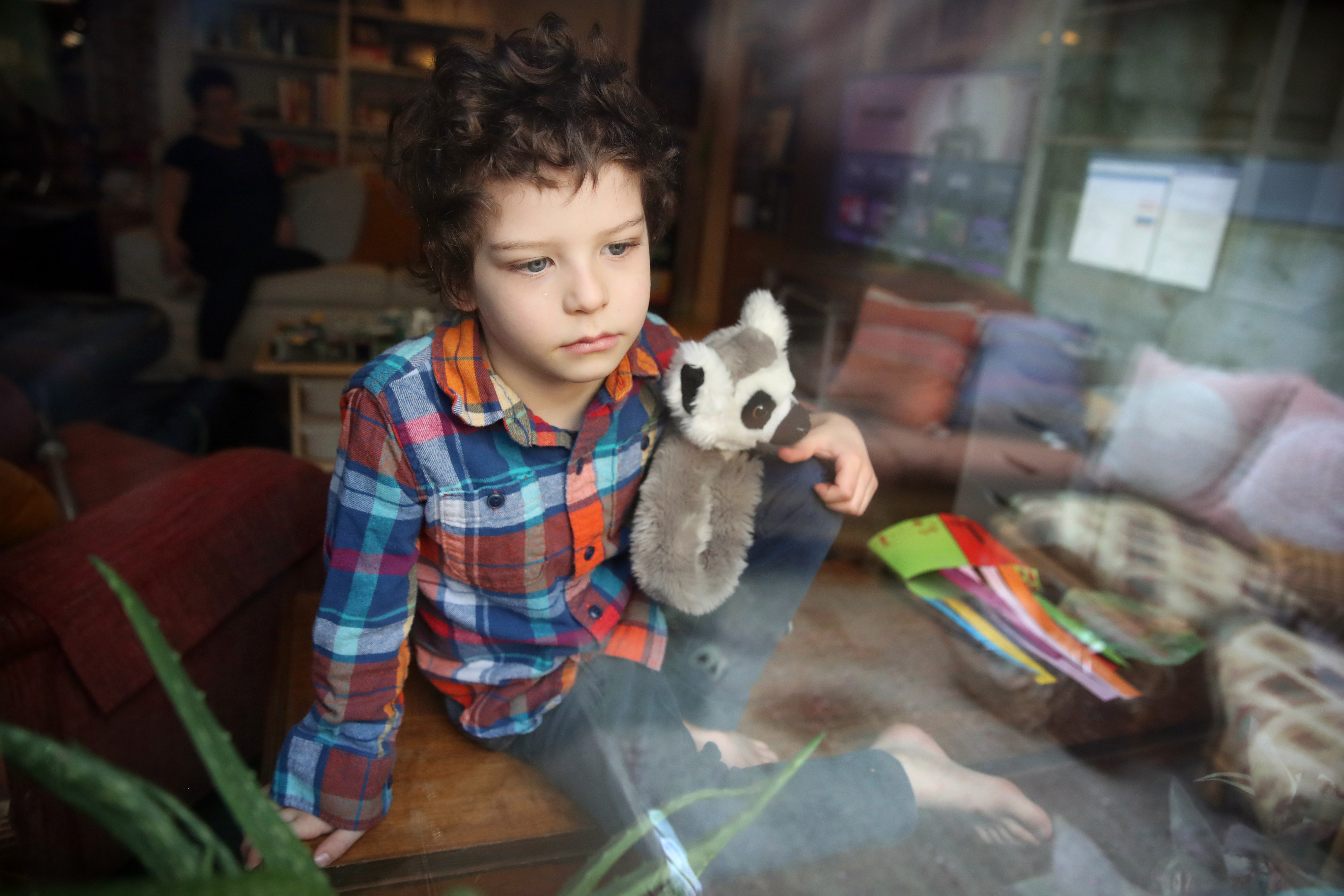 Boston,MA - 4/14/2020:Louis Kroll, 5, poses for portrait at his in the Jamaica Plain neighborhood of Boston, MA on April 14, 2020. His parents Seth and Nicole have wrestled with the idea of a little extra screen time during the coronavirus stay-at-home advisory. (Craig F. Walker/Globe Staff)