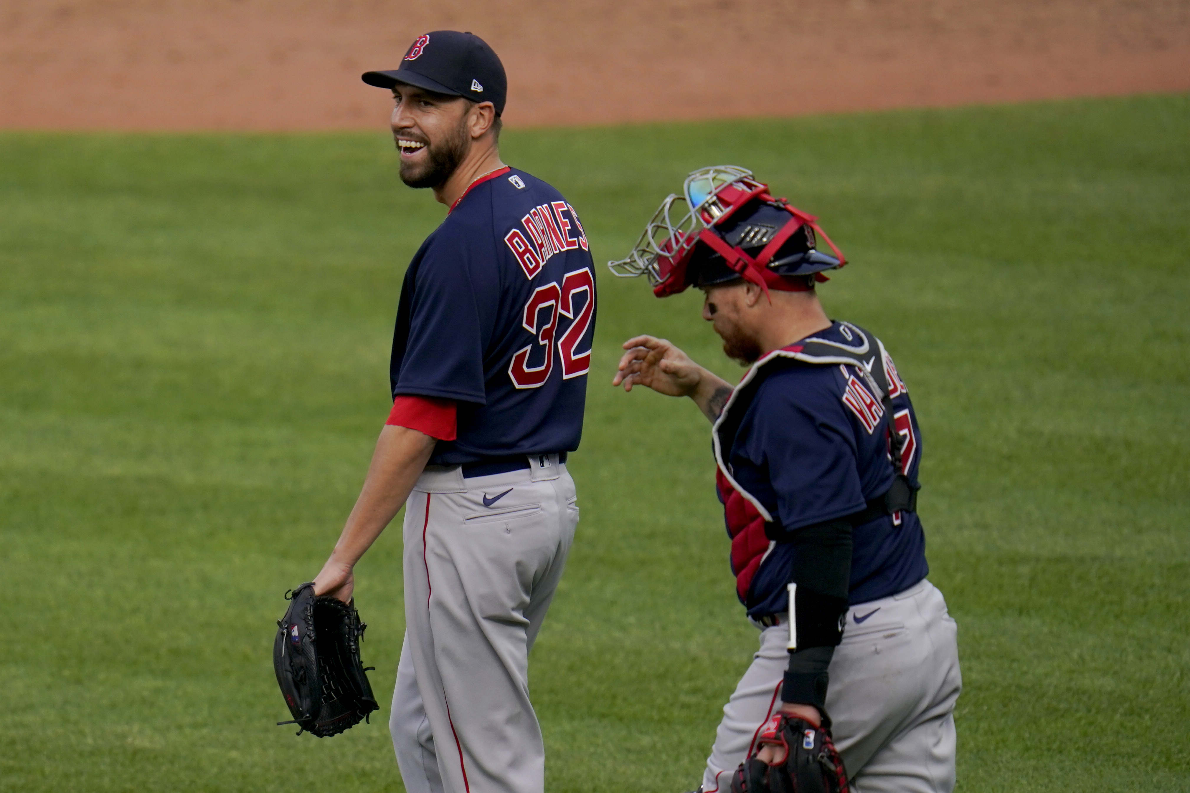 Matt Barnes and Christian Vazquez react after getting the final out of Thursday's 7-3 win over the Orioles.