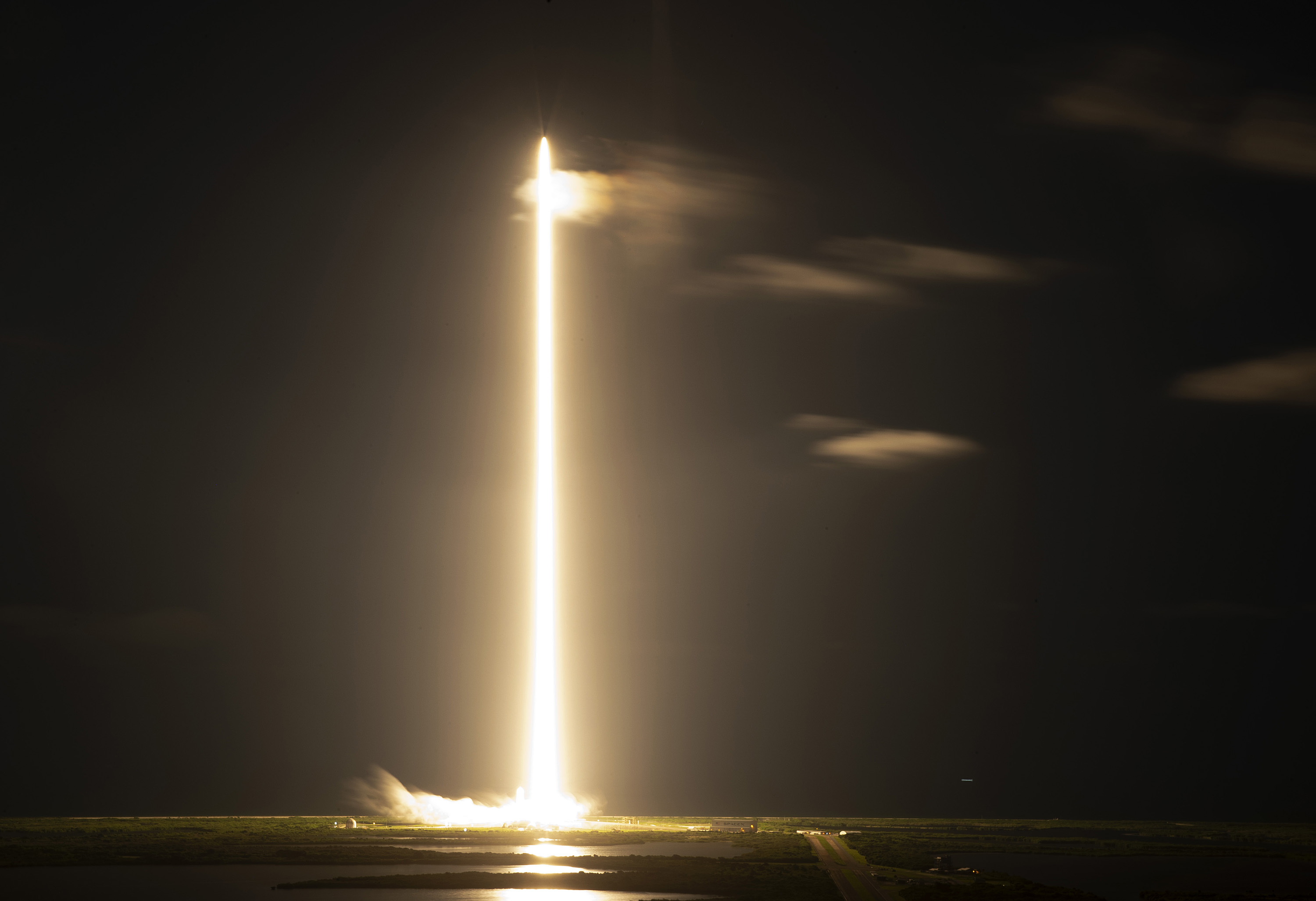 A long exposure shows the SpaceX Falcon 9 rocket with Crew Dragon capsule as it flew into orbit.