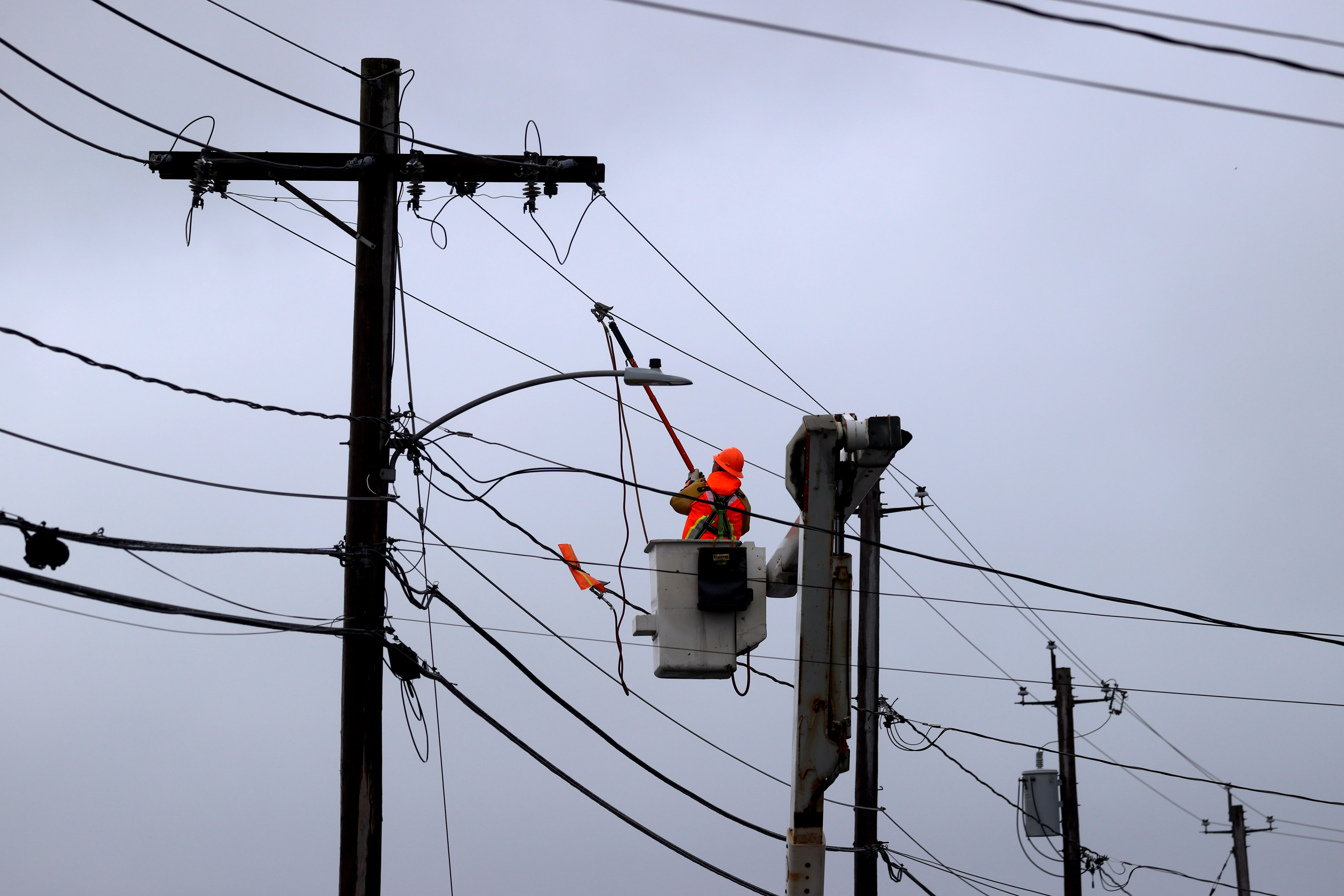 A utility company crew worked on repairs on Border Street in Cohasset.