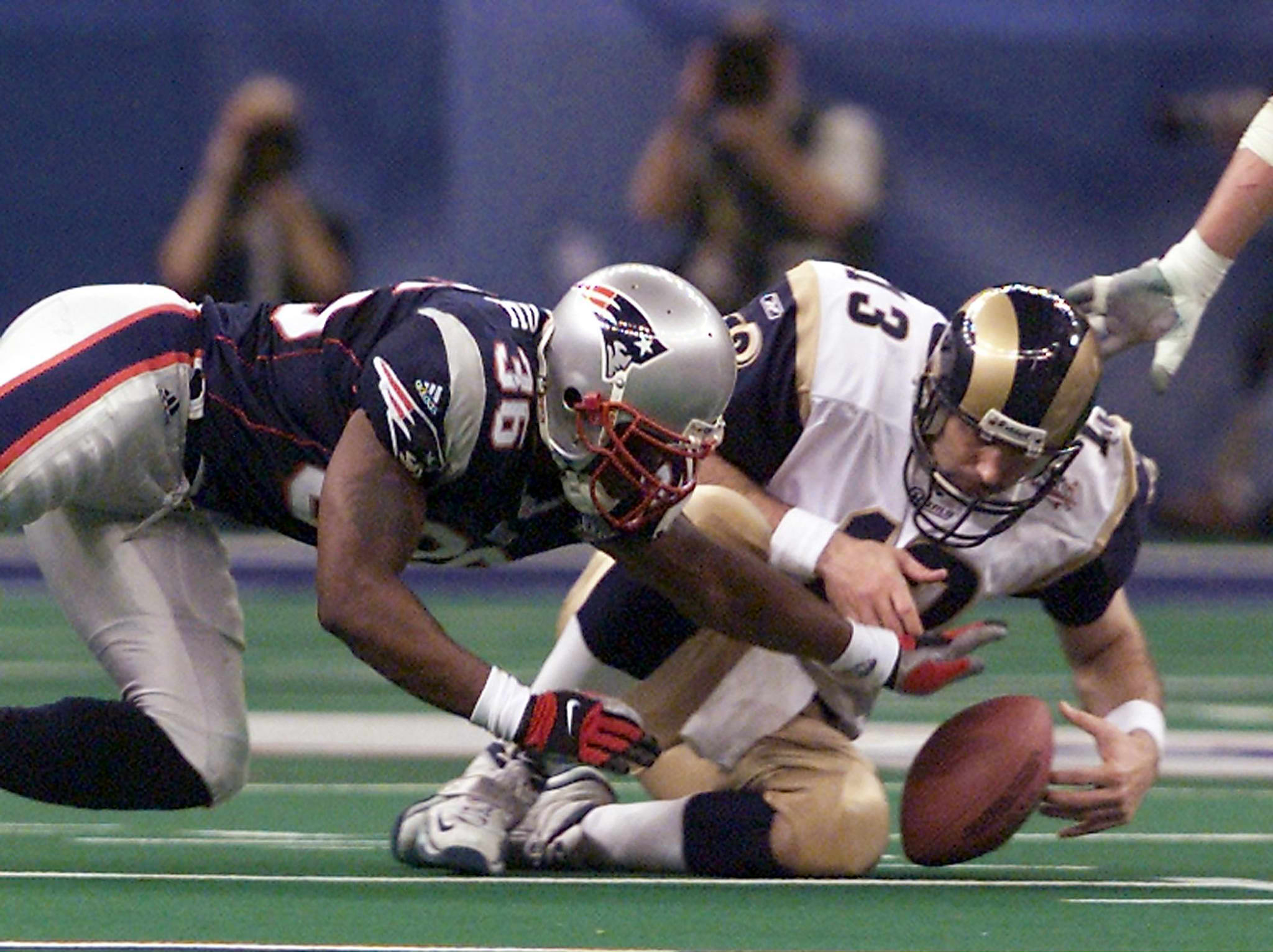 In Super Bowl XXXVI, the Patriots took down the powerful Rams, led by Kurt Warner (right).