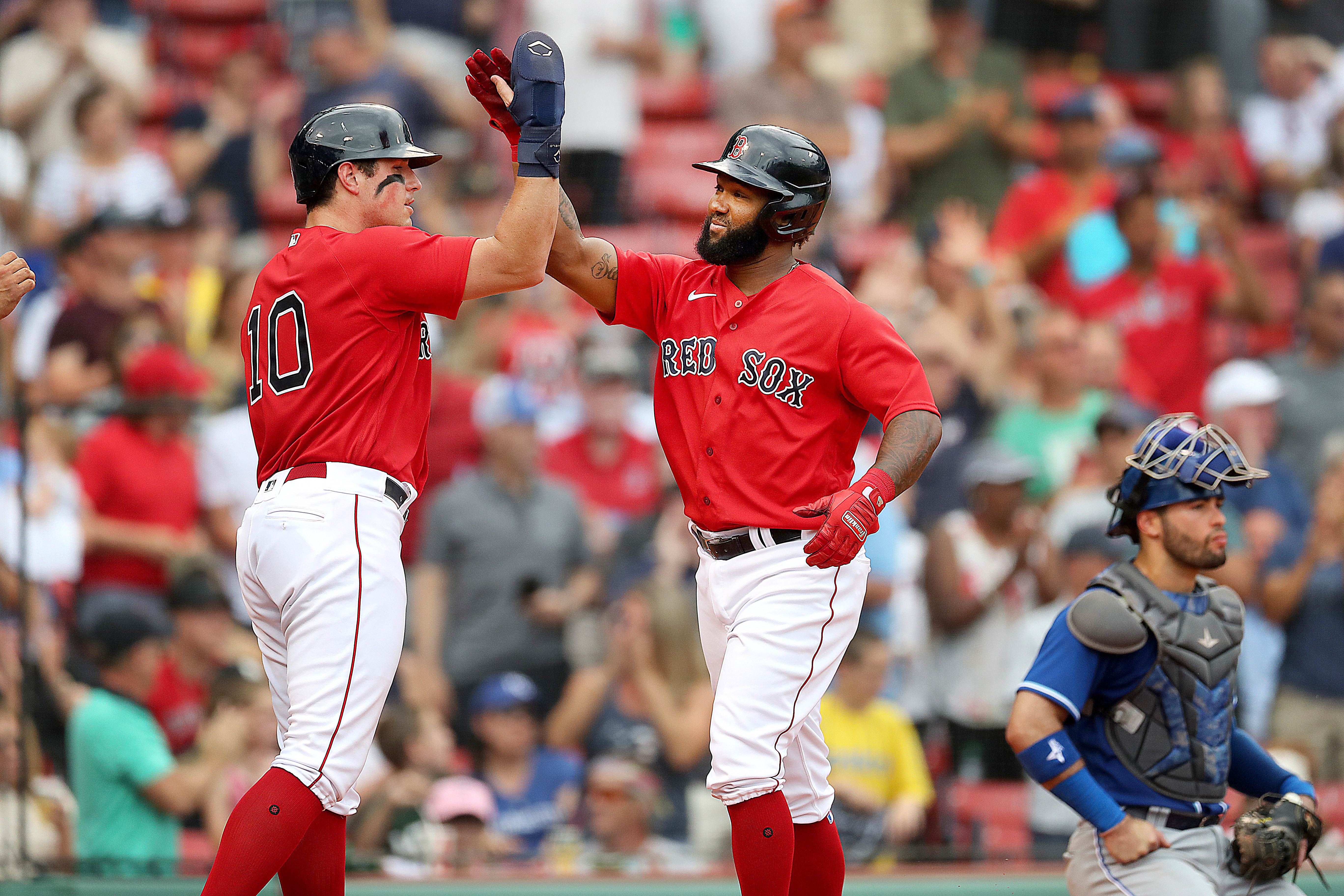 J.D. Martinez of the Boston Red Sox is pushed in a laundry cart