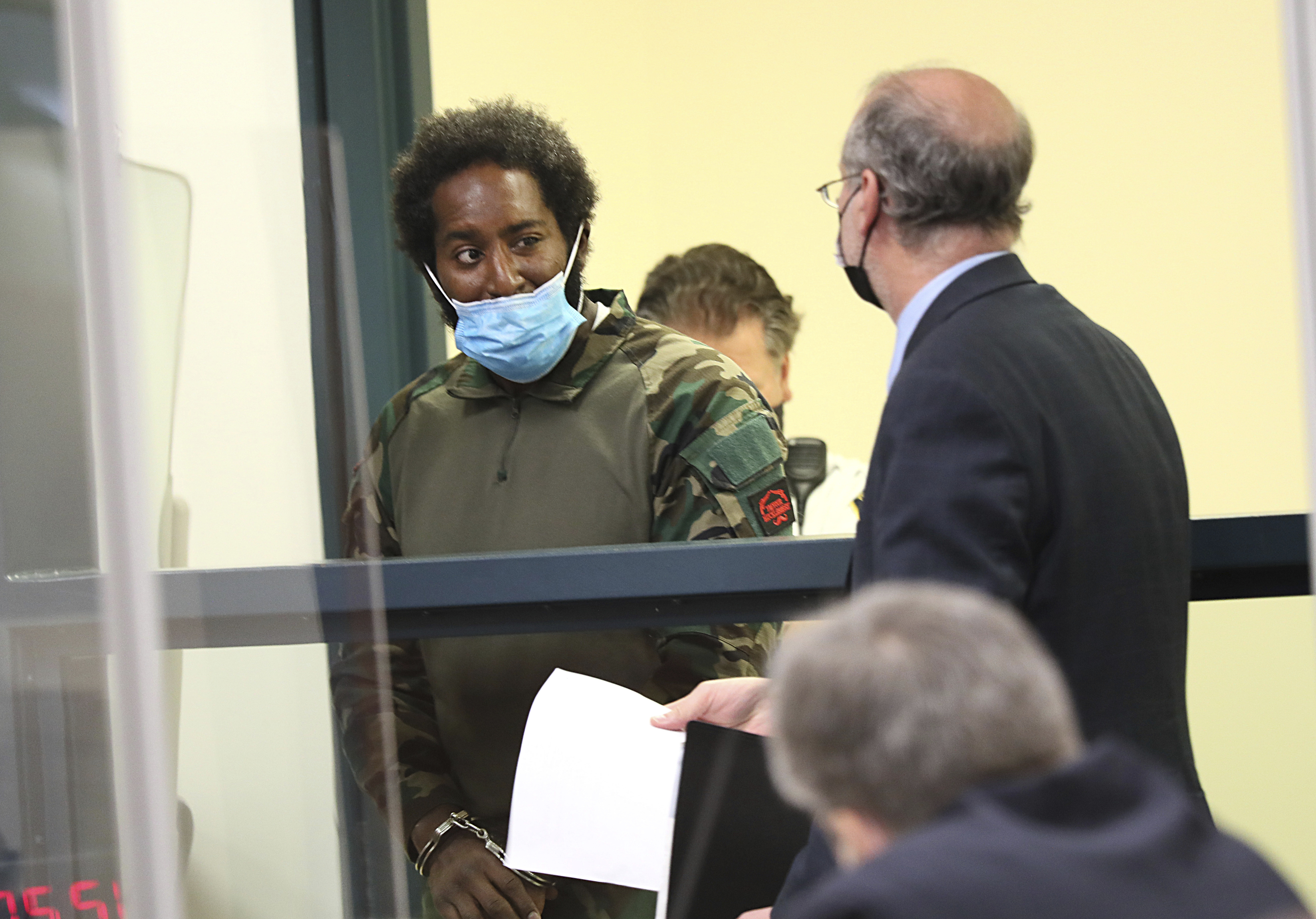 Quinn Cumberlander (left) one of 11 people charged in connection with an armed standoff along a Massachusetts highway last weekend.