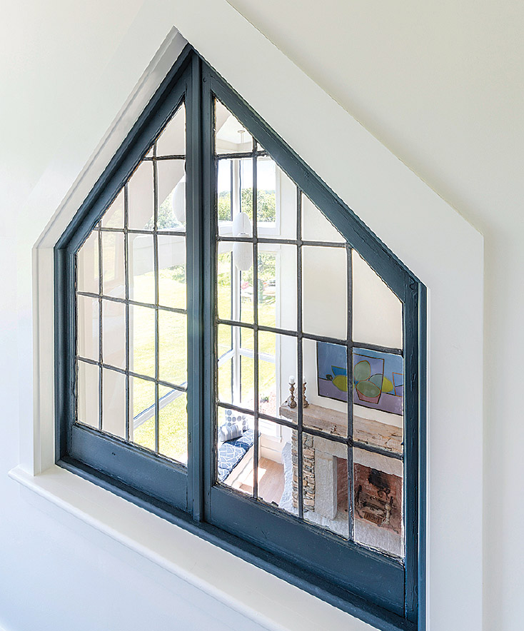 The designers discovered the salvaged window at Nor’east Architectural Antiques in South Hampton, New Hampshire. “It was dirty and beat up, but the size and shape were perfect,” Andrea says.