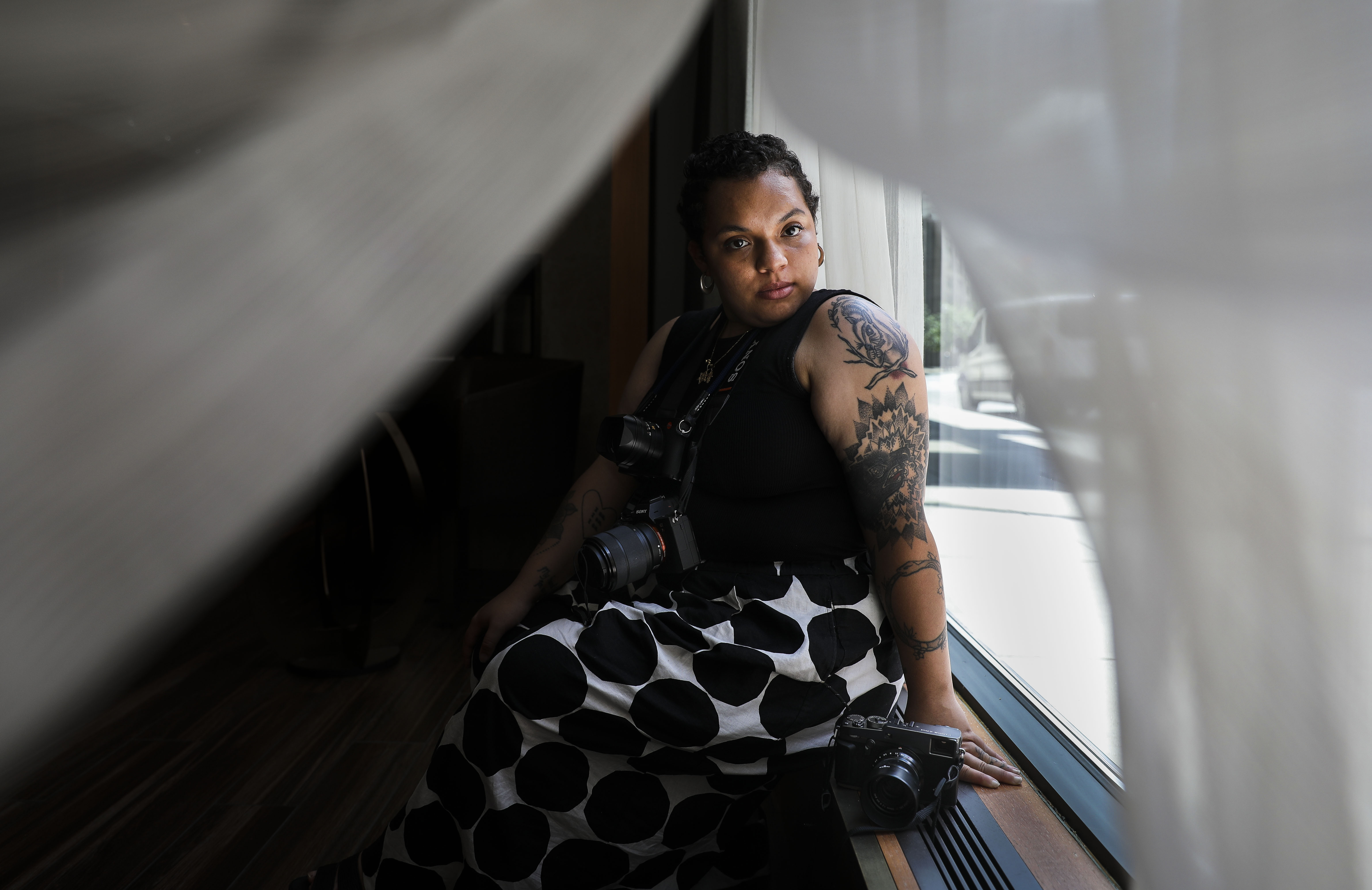 "I do this because I believe it’s my gift,'' OJ Slaughter said of photographing protests.