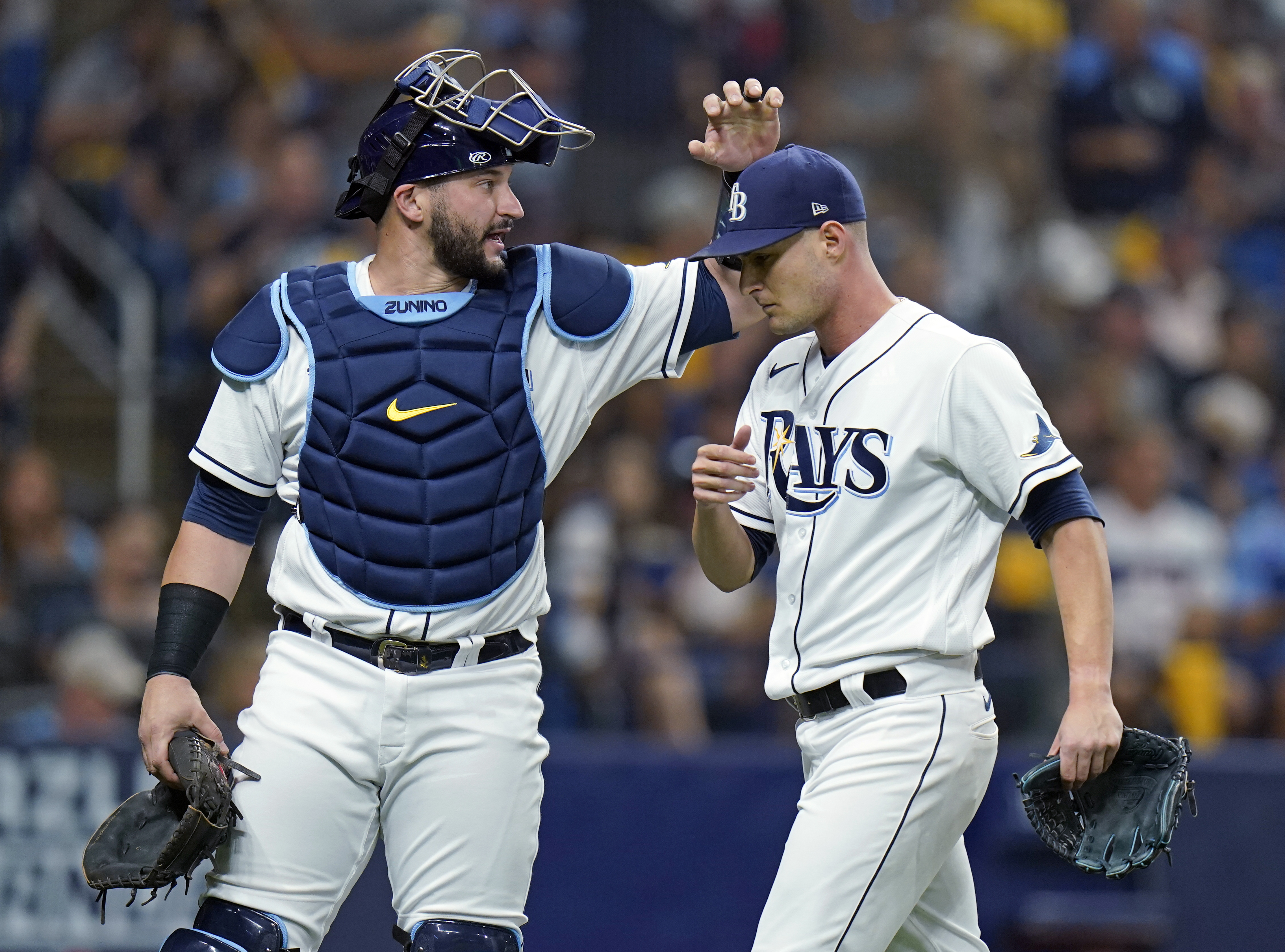 Mike Zunino acknowledges the work of Shane McClanahan in the second inning of Thursday's Game 1.