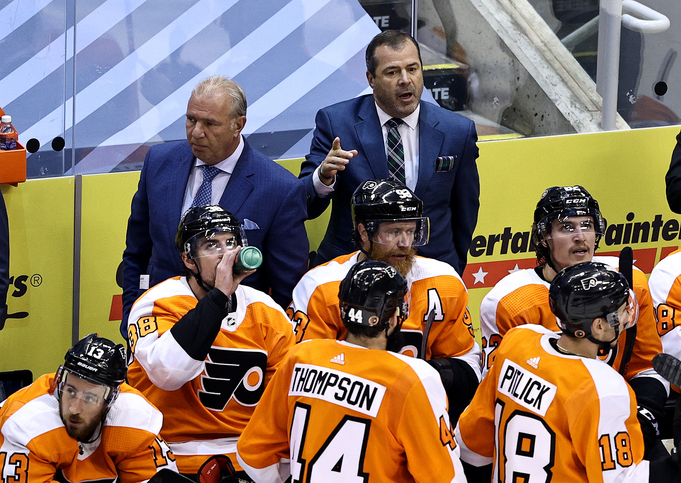 Philadelphia head coach Alain Vigneault talks with his players during a recent contest.