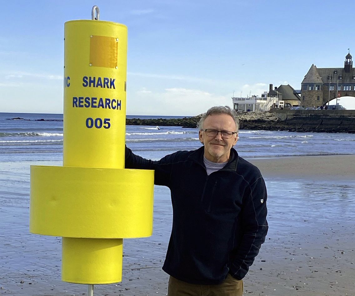 Jon Dodd, executive director of the Atlantic Shark Institute, stands next to an acoustic receiver used to detect tagged white sharks in the ocean.