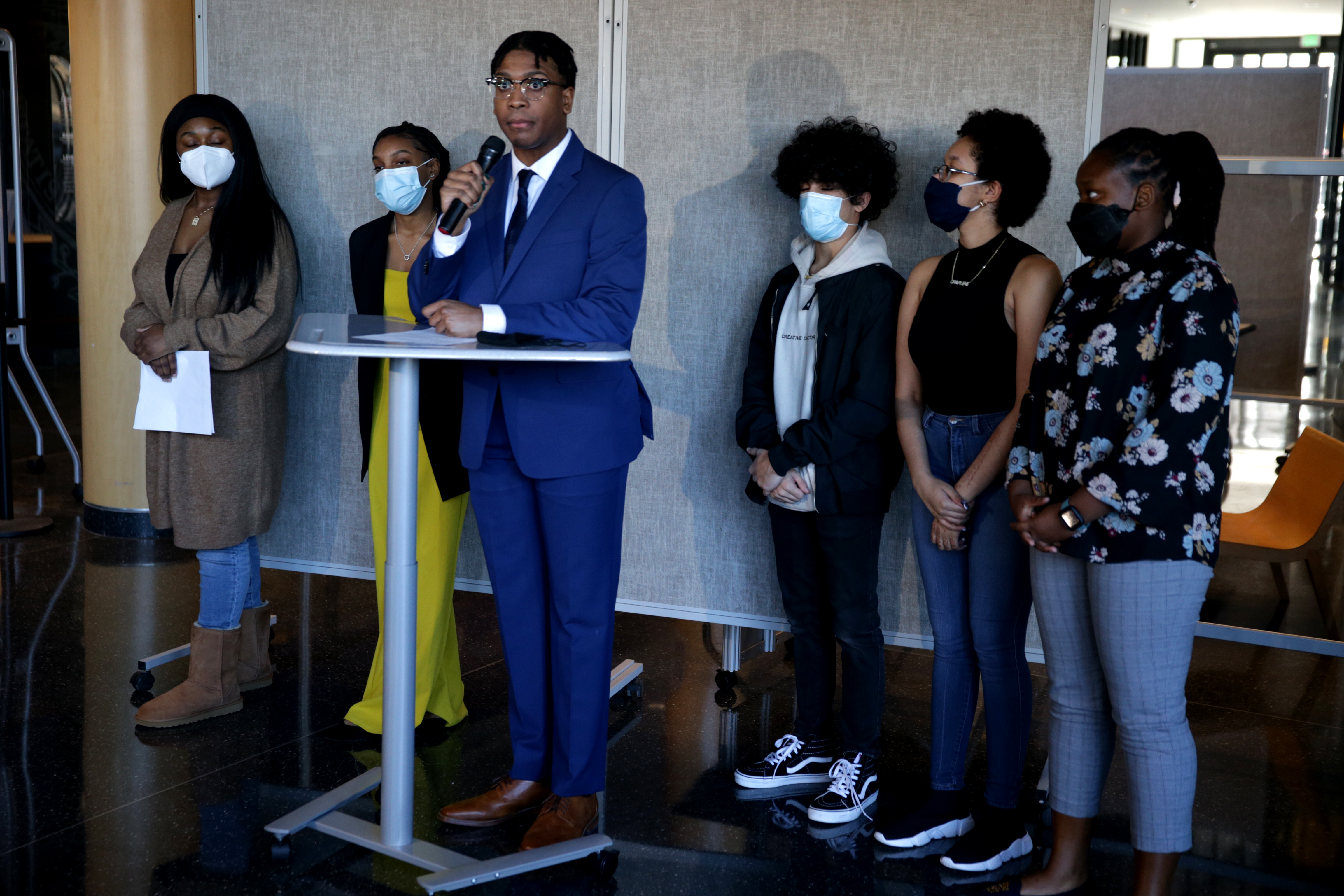 During a March 6 news conference, then-Boston School Committee member Khymani James and five other students announced their resignations from the council and alleged Sazama emotionally abused students and recruited them into her RC "cult."