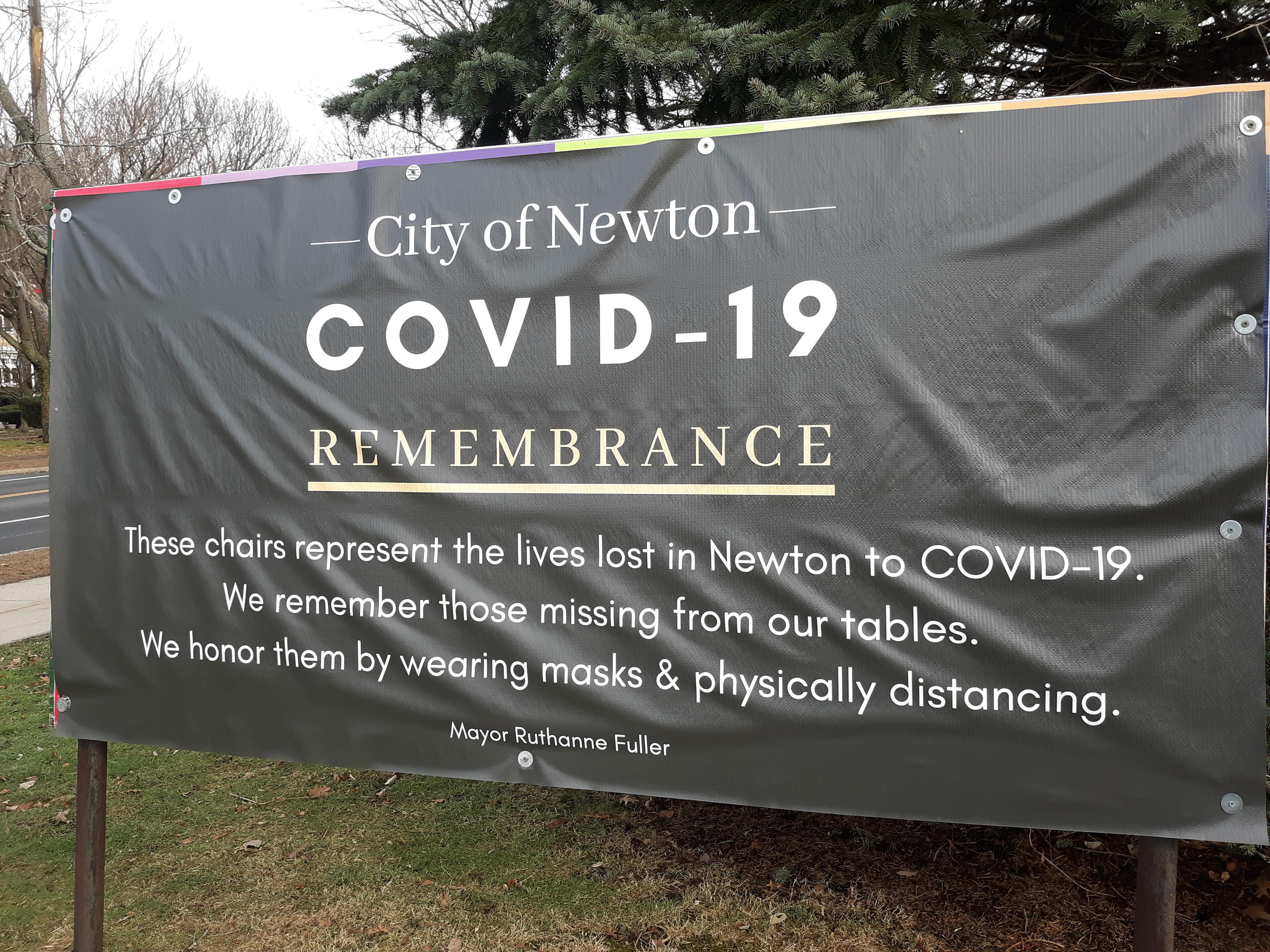 A sign describes the chair memorial outside Newton City Hall.