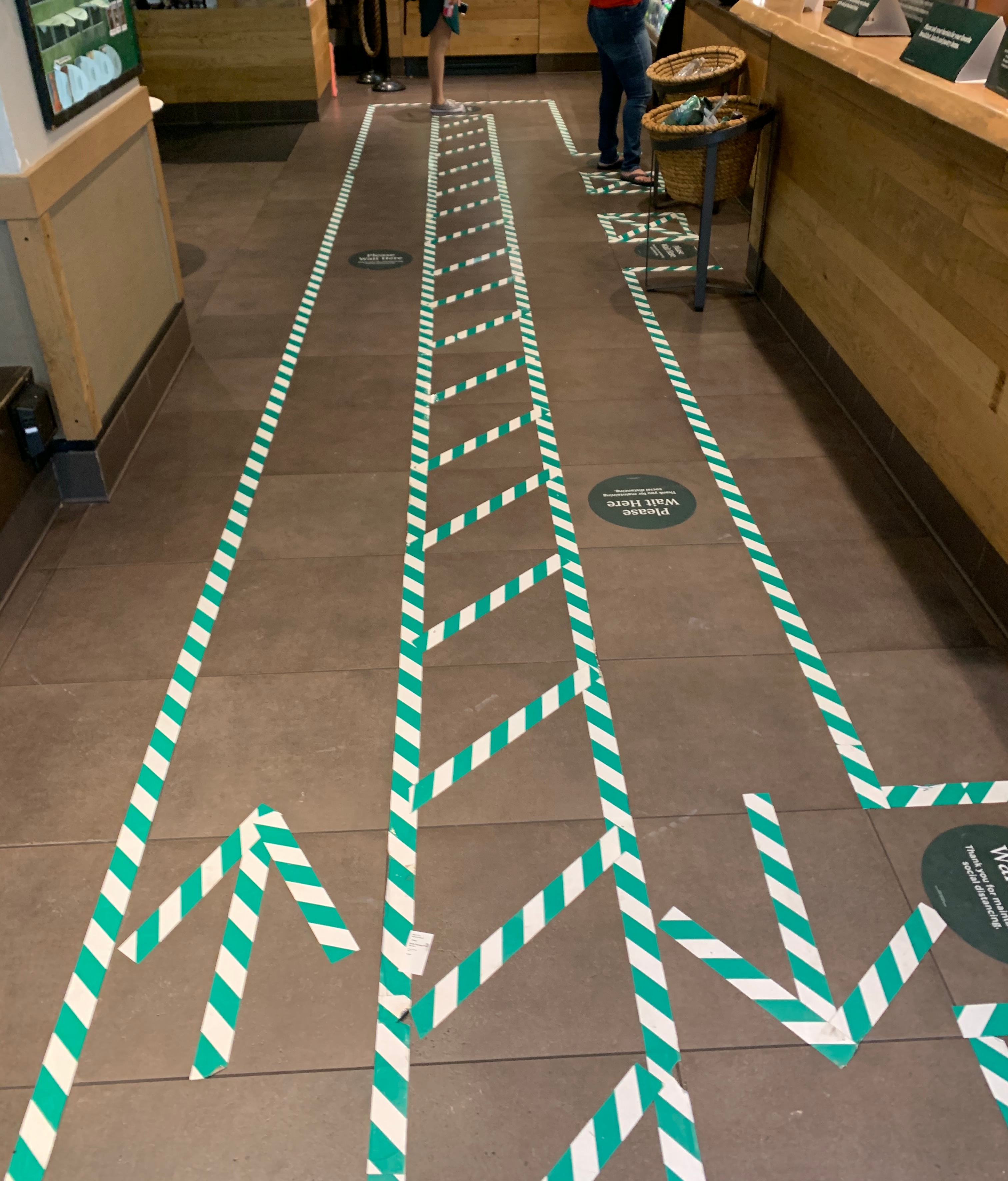 Directional line stickers and social distancing cues in Starbucks in the Back Bay.
