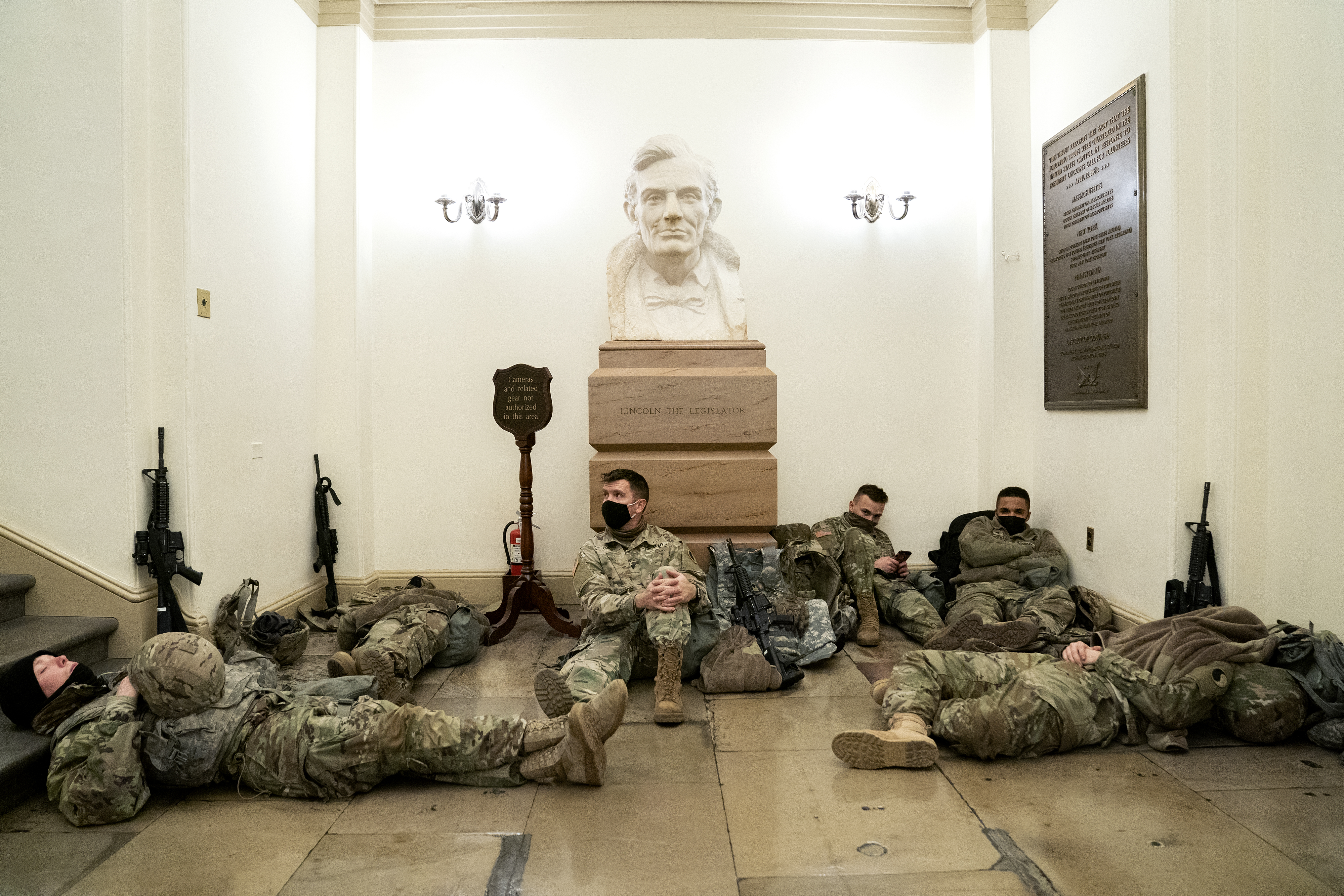 Members of the National Guard rested in the US Capitol.