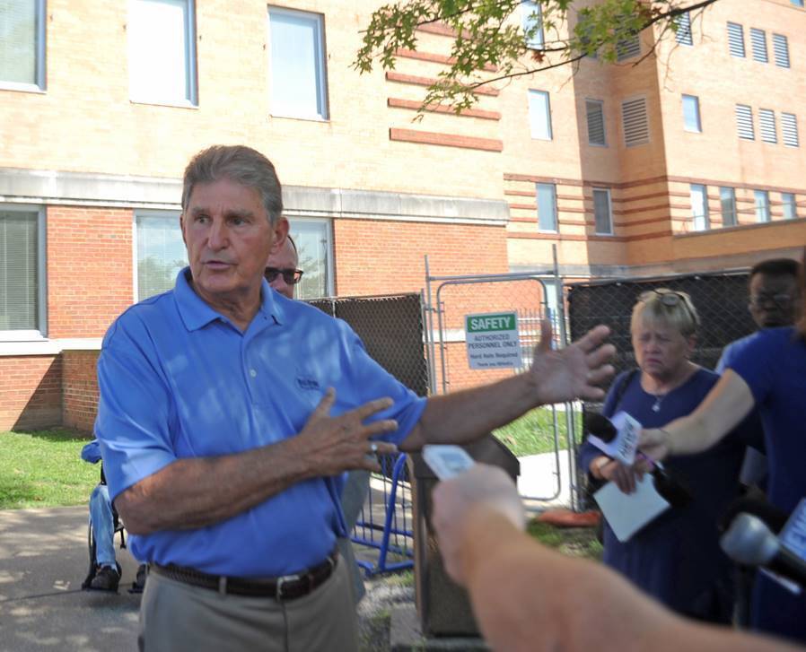 US Senator Joe Manchin spoke to reporters outside of the Louis A. Johnson VA Medical Center in Clarksburg, W. Va.