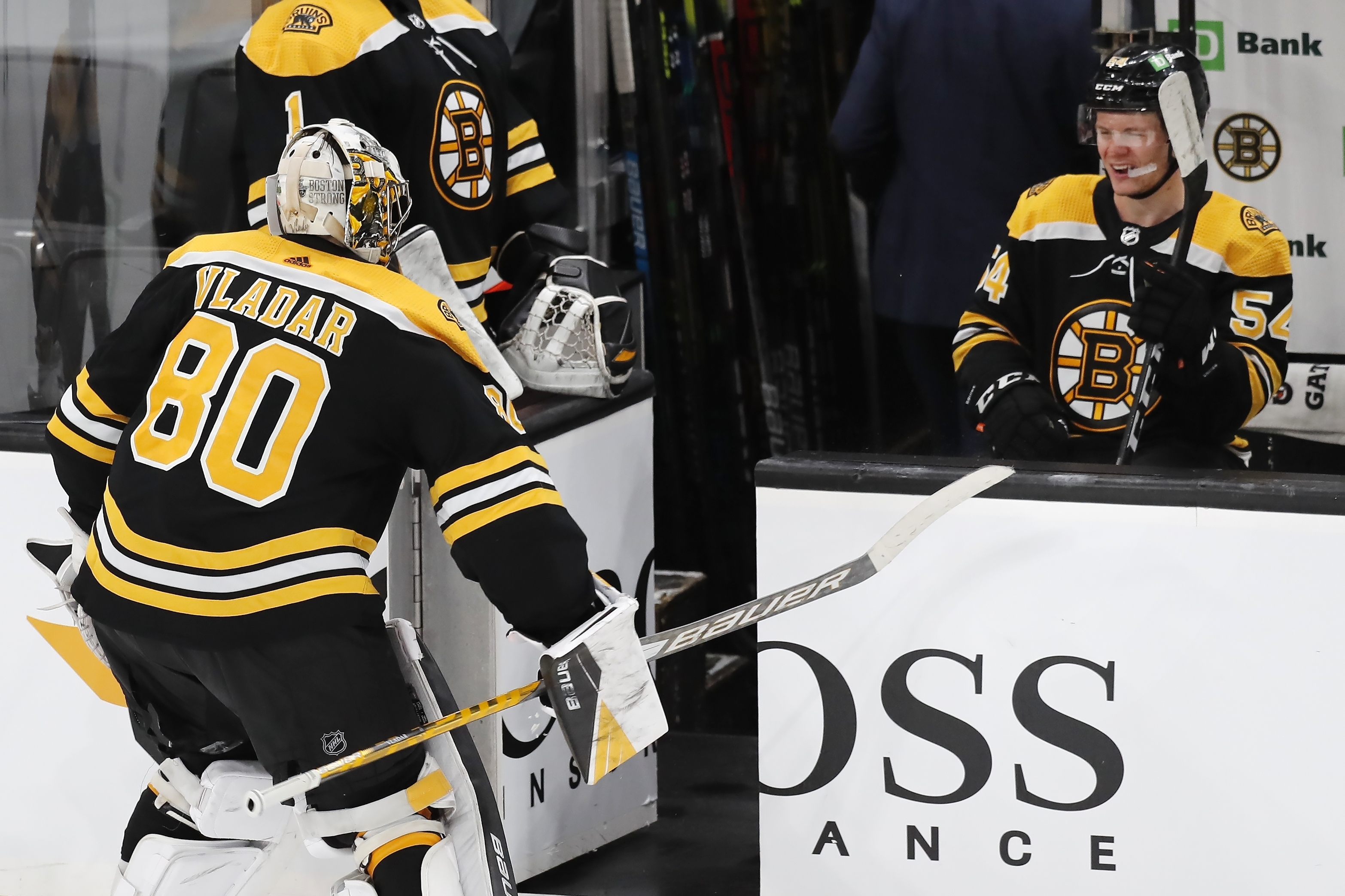 Dan Vladar slams his stick on the boards in front of teammate Jack Ahcan at the conclusion of Sunday's game.