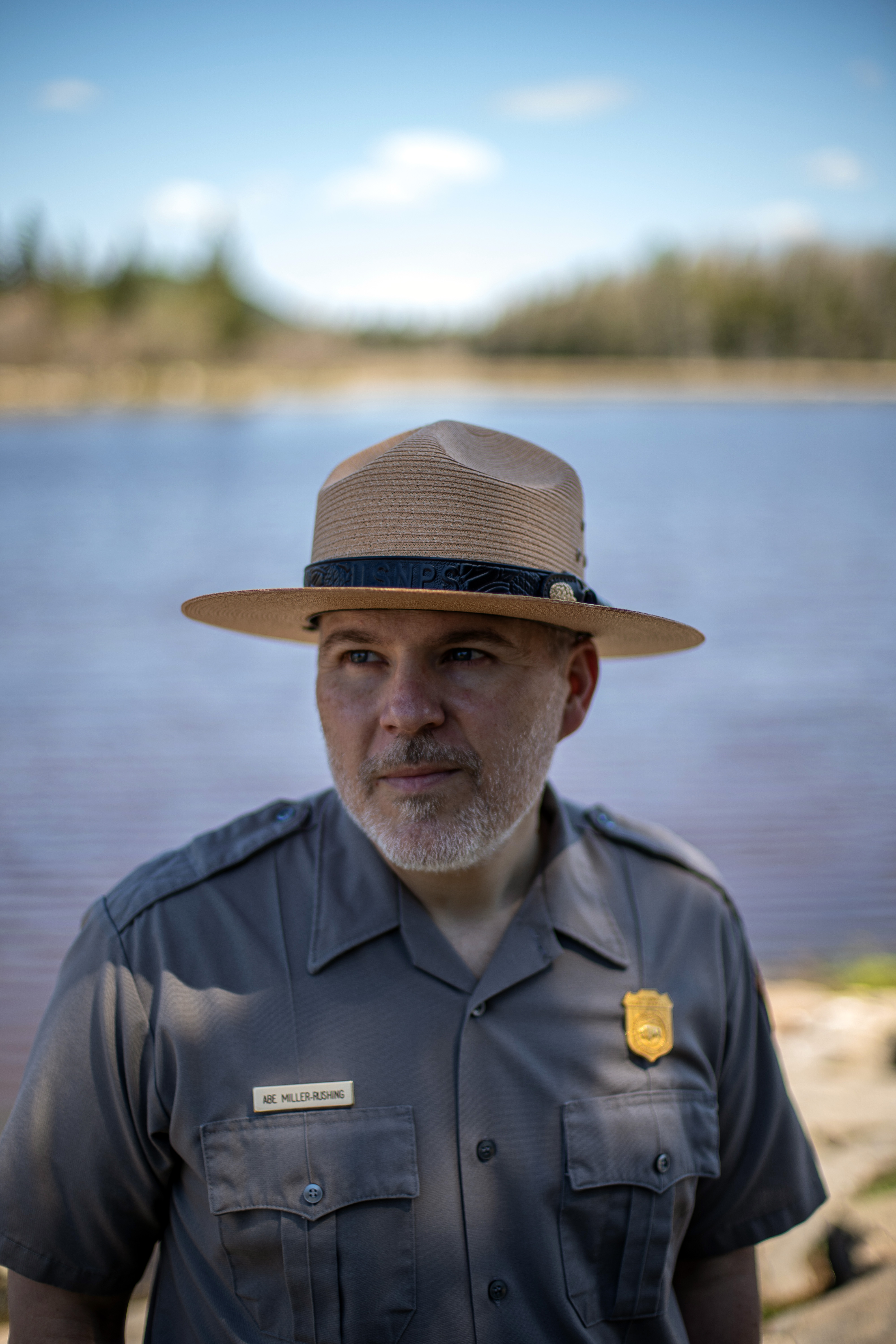 Abraham Miller-Rushing, an ecologist and the science coordinator at Acadia National Park, at Bass Harbor Marsh in the park in Maine. For decades, the core mission of the Park Service was absolute conservation. Now ecologists are being forced to do triage, deciding what to safeguard — and what to let slip away.