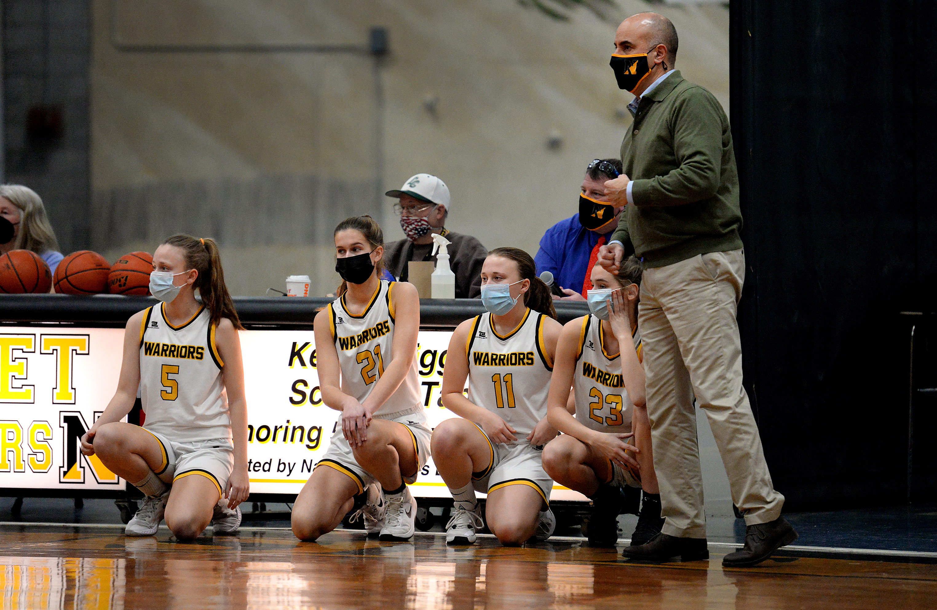 With Monday's victory over Nantucket well in hand, Nauset girls' basketball coach John Piemontese (right) prepares to insert his reserves into the game.