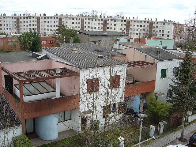 Le Corbusier's Cité Frugès de Pessac is an example of the white-walled modernism to arise after the Spanish flu pandemic. The housing development was built in the 1920s in Pessac, a suburb of Bordeaux, France.