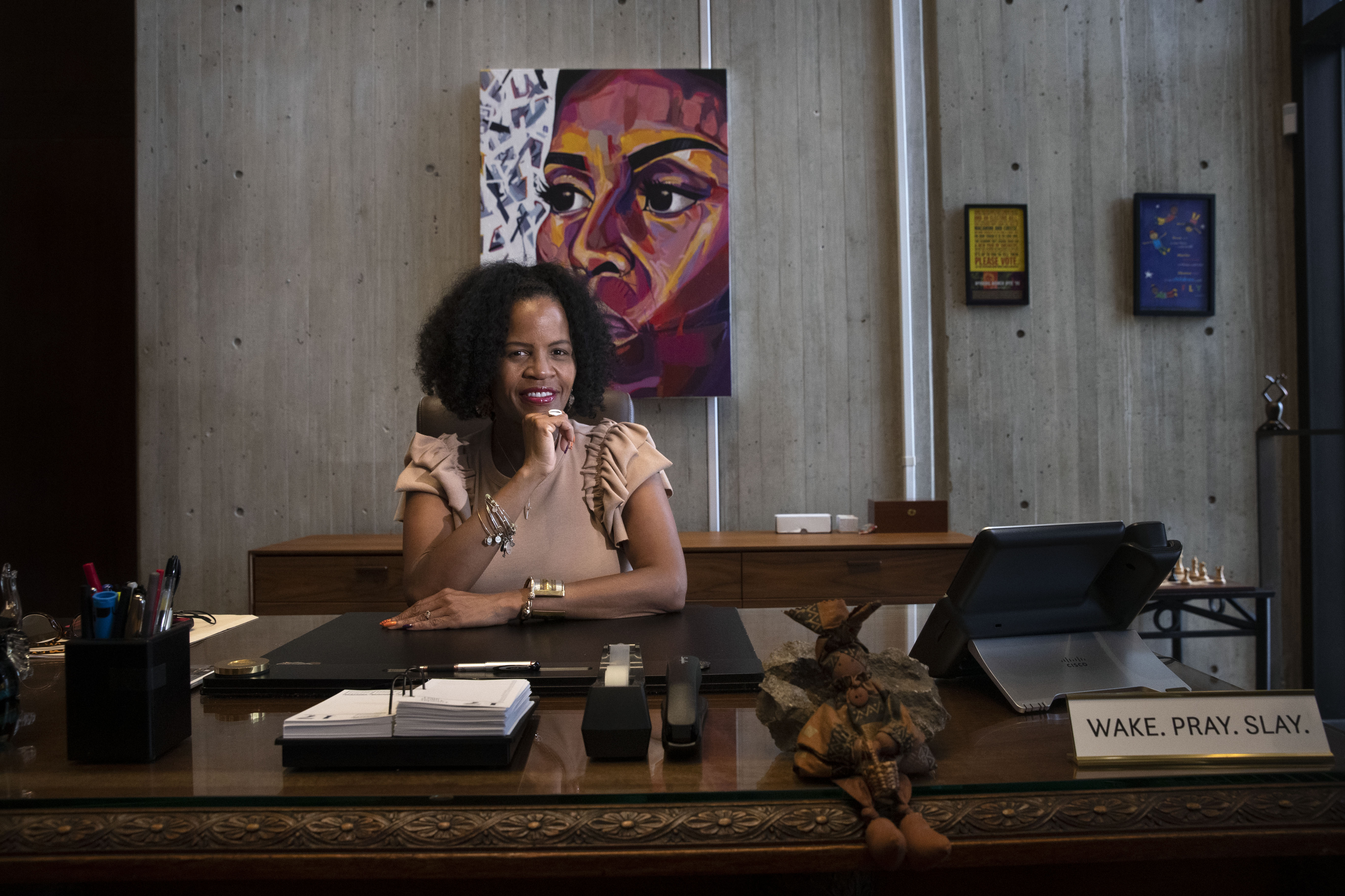 Behind Acting Mayor Kim Janey's desk is a bright portrait of former first lady Michelle Obama by Maya Das O’Toole, who, Janey points out, was a Boston Public Schools student when she painted it.