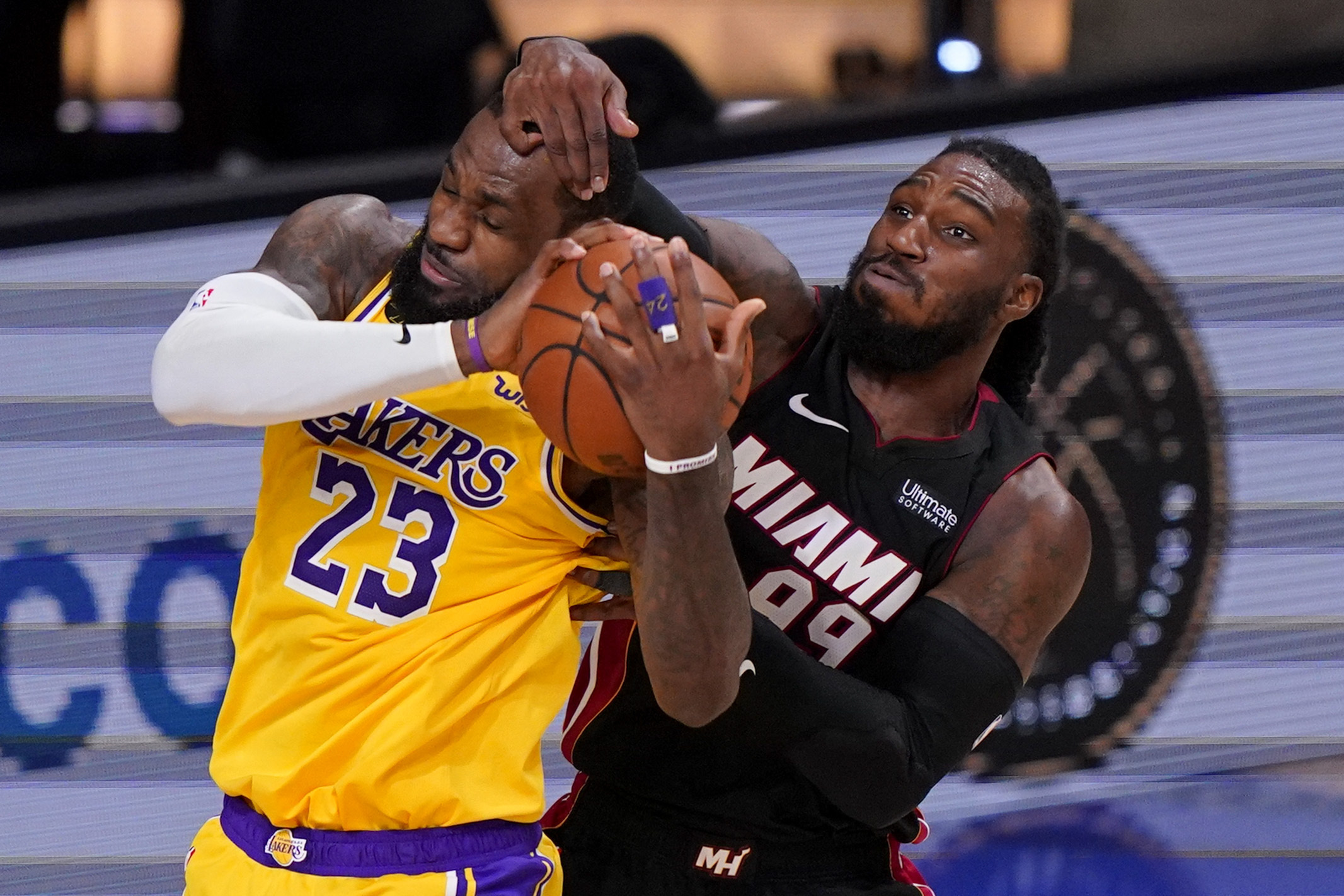 LeBron James and Jae Crowder battle for a rebound during the second half of Tuesday's game.