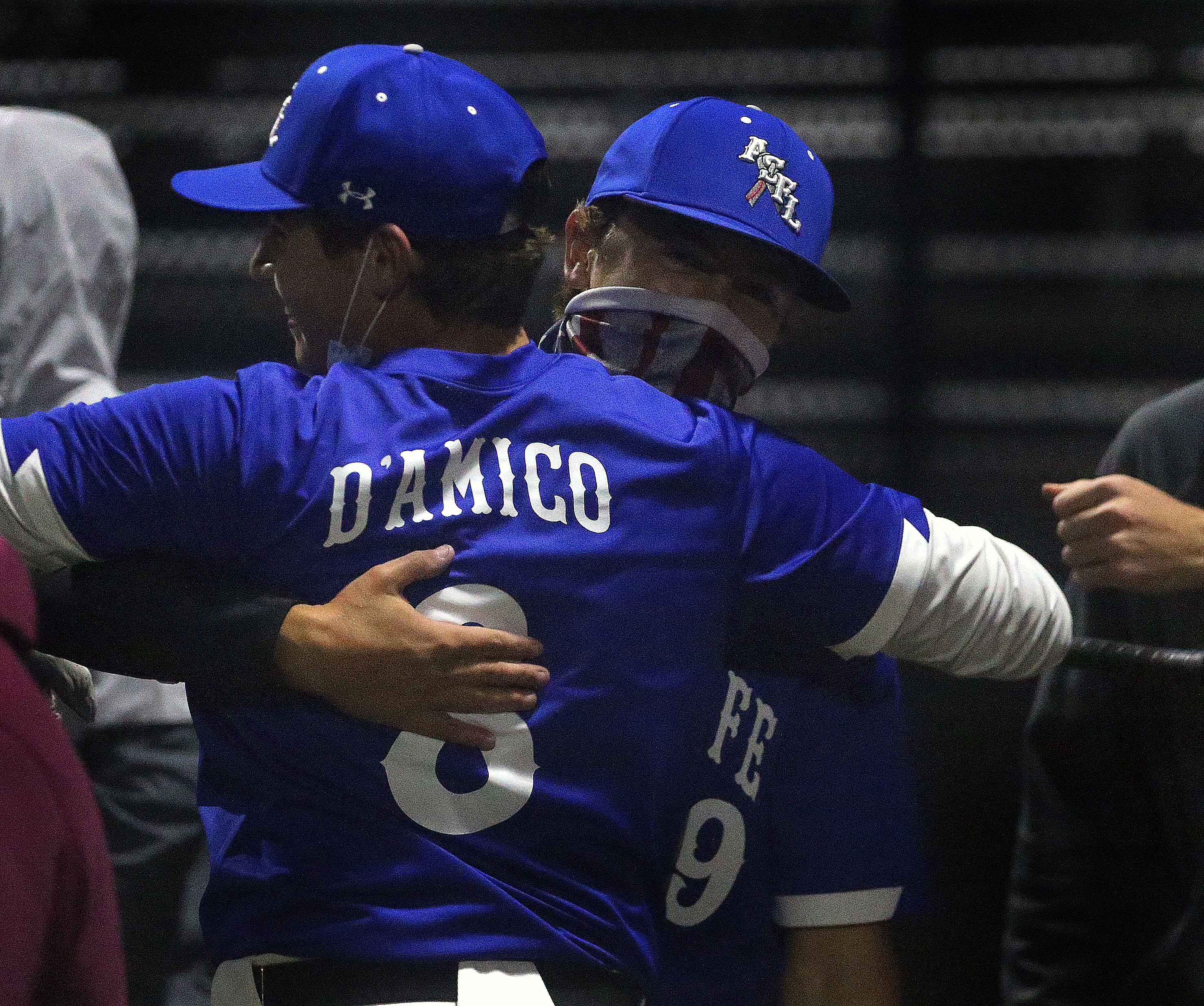 Runner-up Pat D'Amico of St. John's Prep hugs champion Zach Stephenson of Bishop Feehan after the final round of the A Shot For Life Home Run Derby at Austin Prep in Reading.