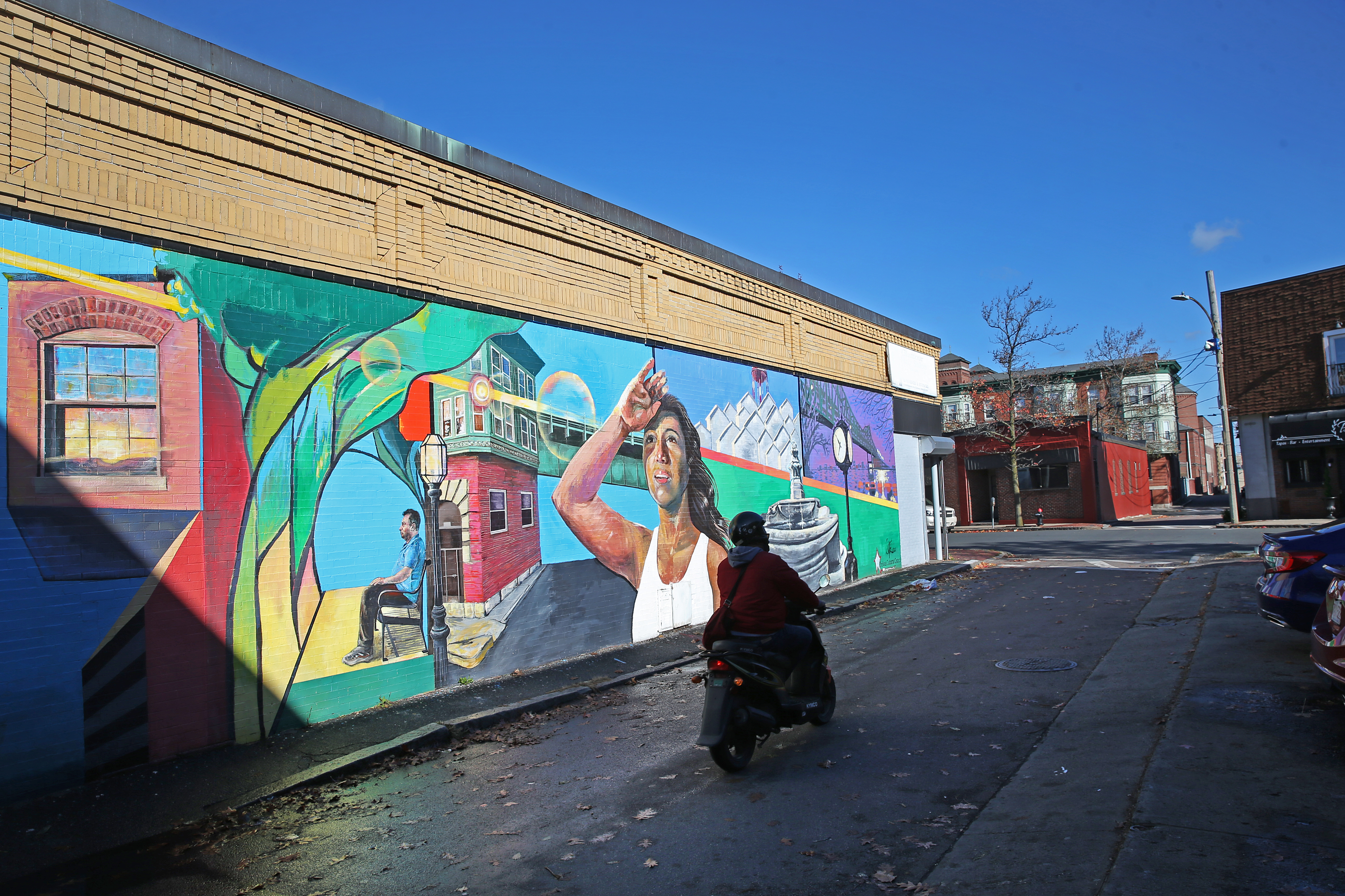 A mural on Cherry street depicting Chelsea landmarks and it's residents.