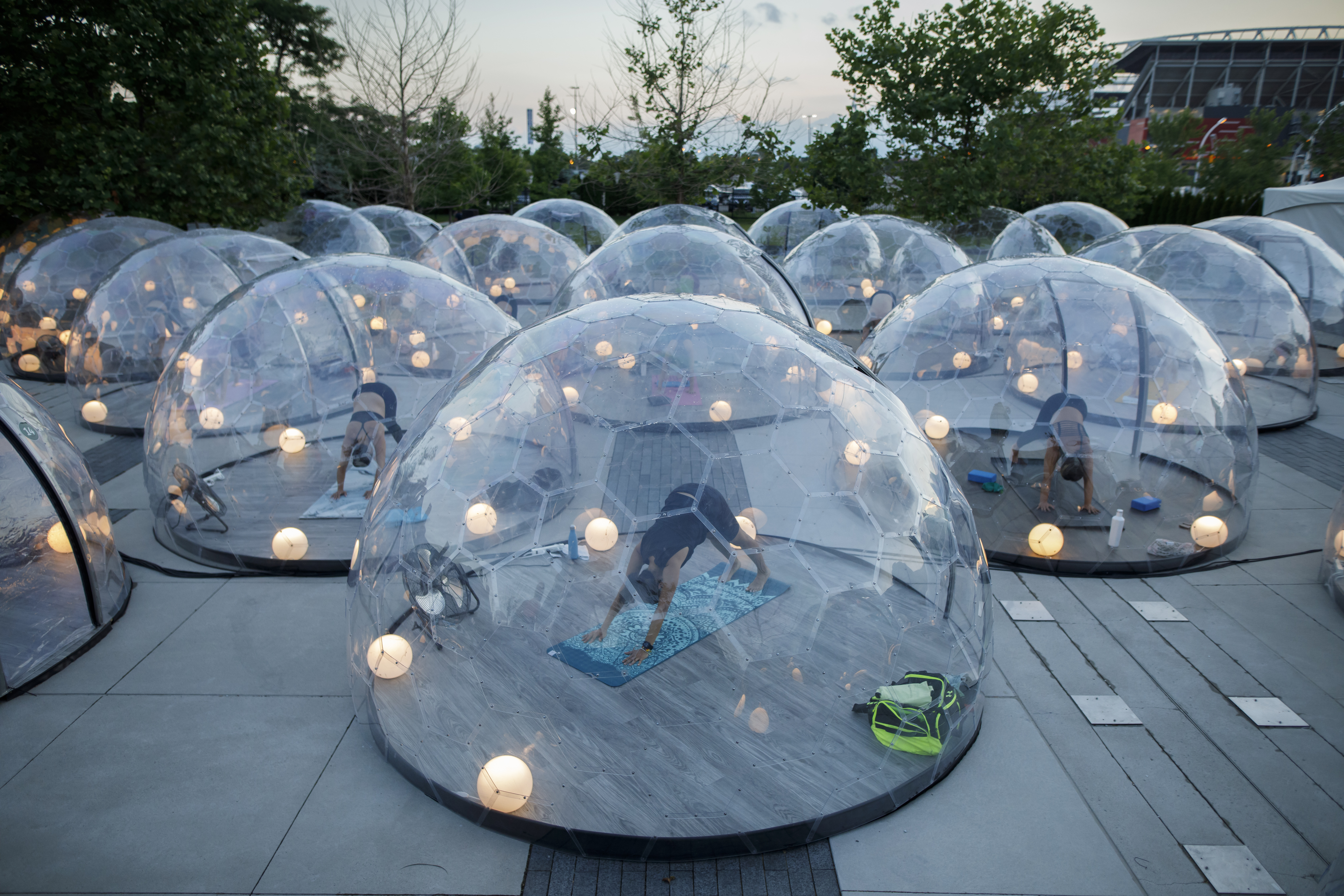 An outdoor yoga class at Hotel X in Toronto last year featured participants inside domes to comply with social distancing measures and to control the spread of COVID-19.
