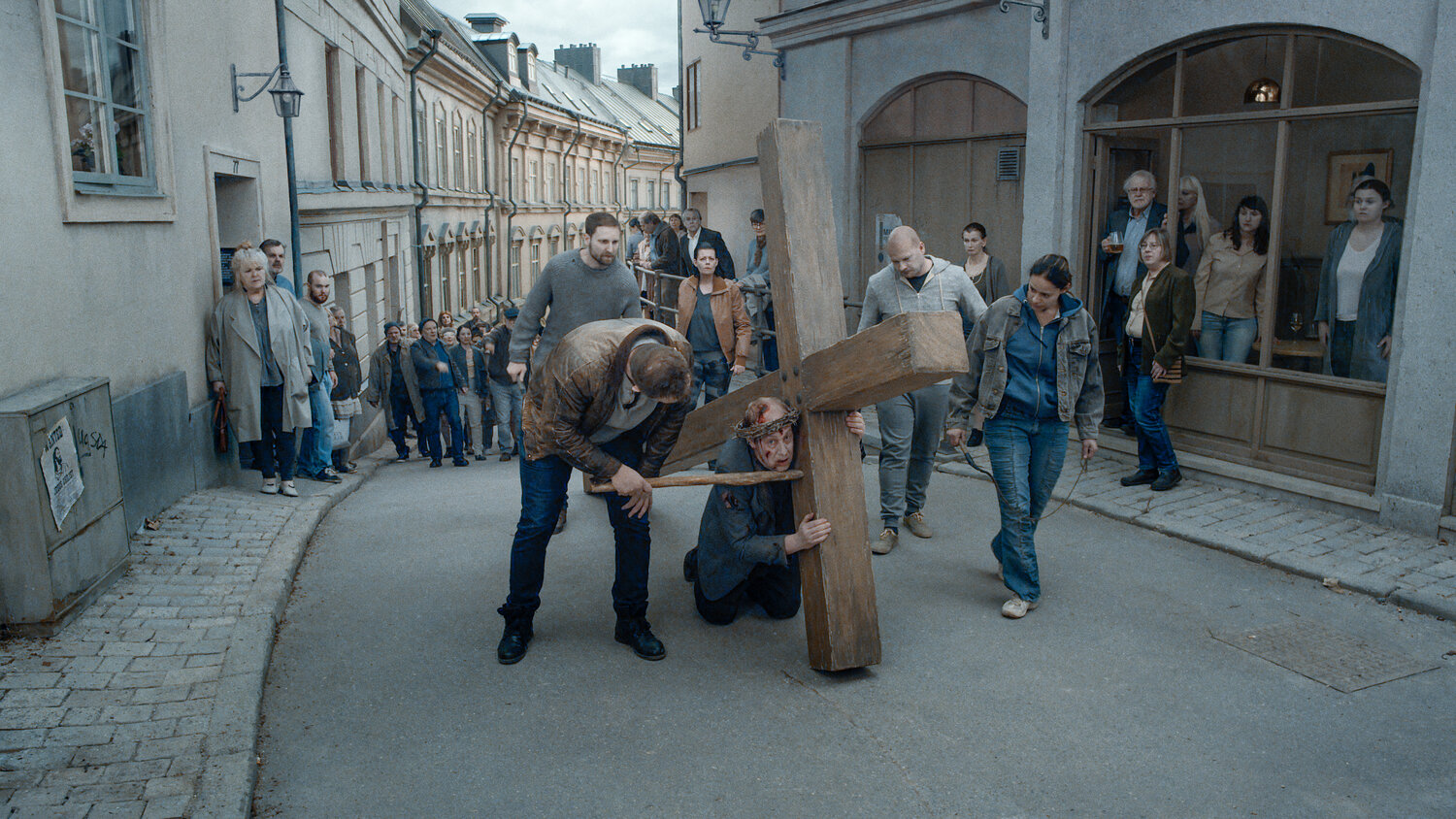 Martin Serner is a priest carrying a cross, in "About Endlessness."