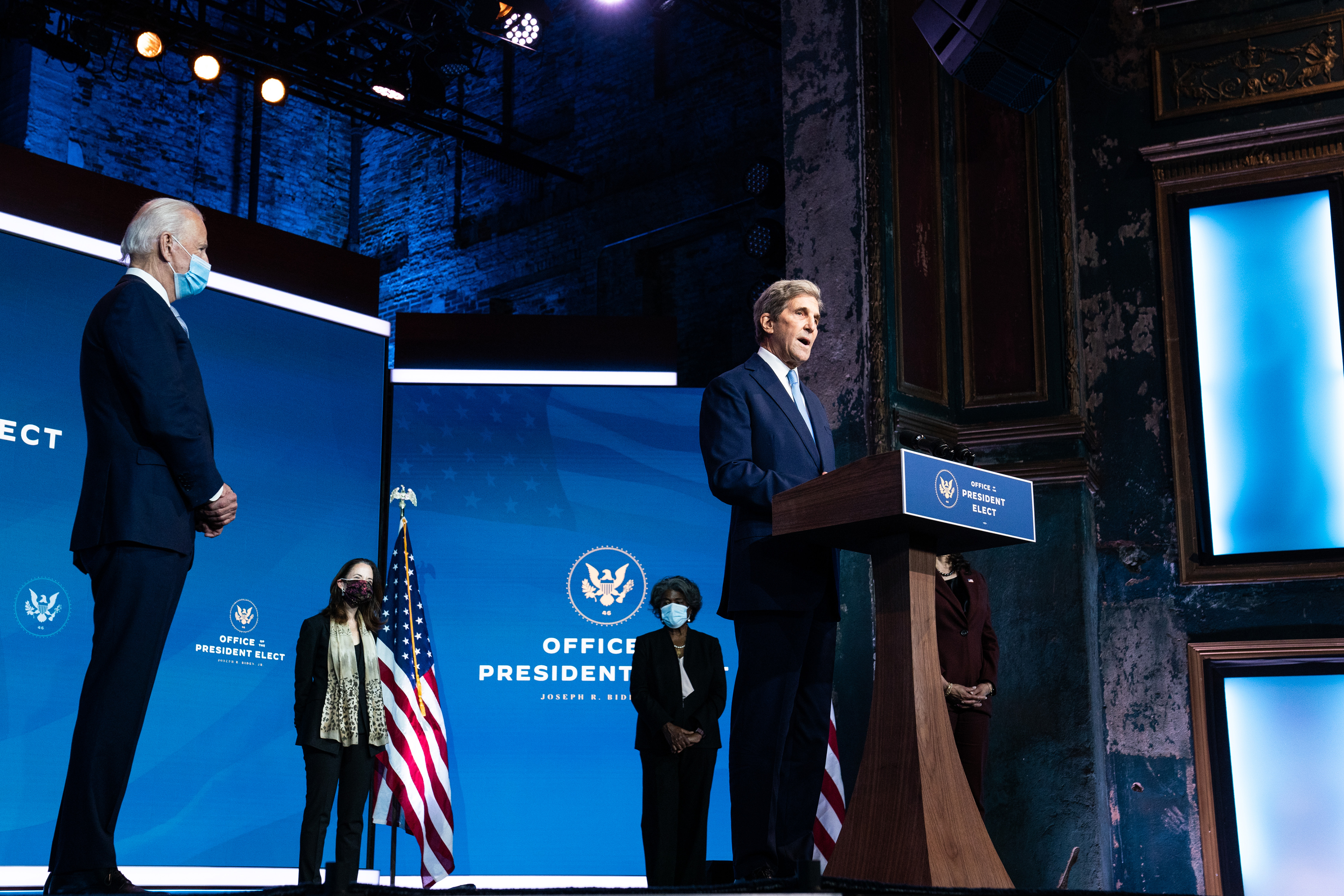 Joe Biden watched John Kerry, his selection to be envoy for climate, speak at an event introducing his nominations and appointments to foreign policy and national security positions in Wilmington, Del., on Nov. 24.