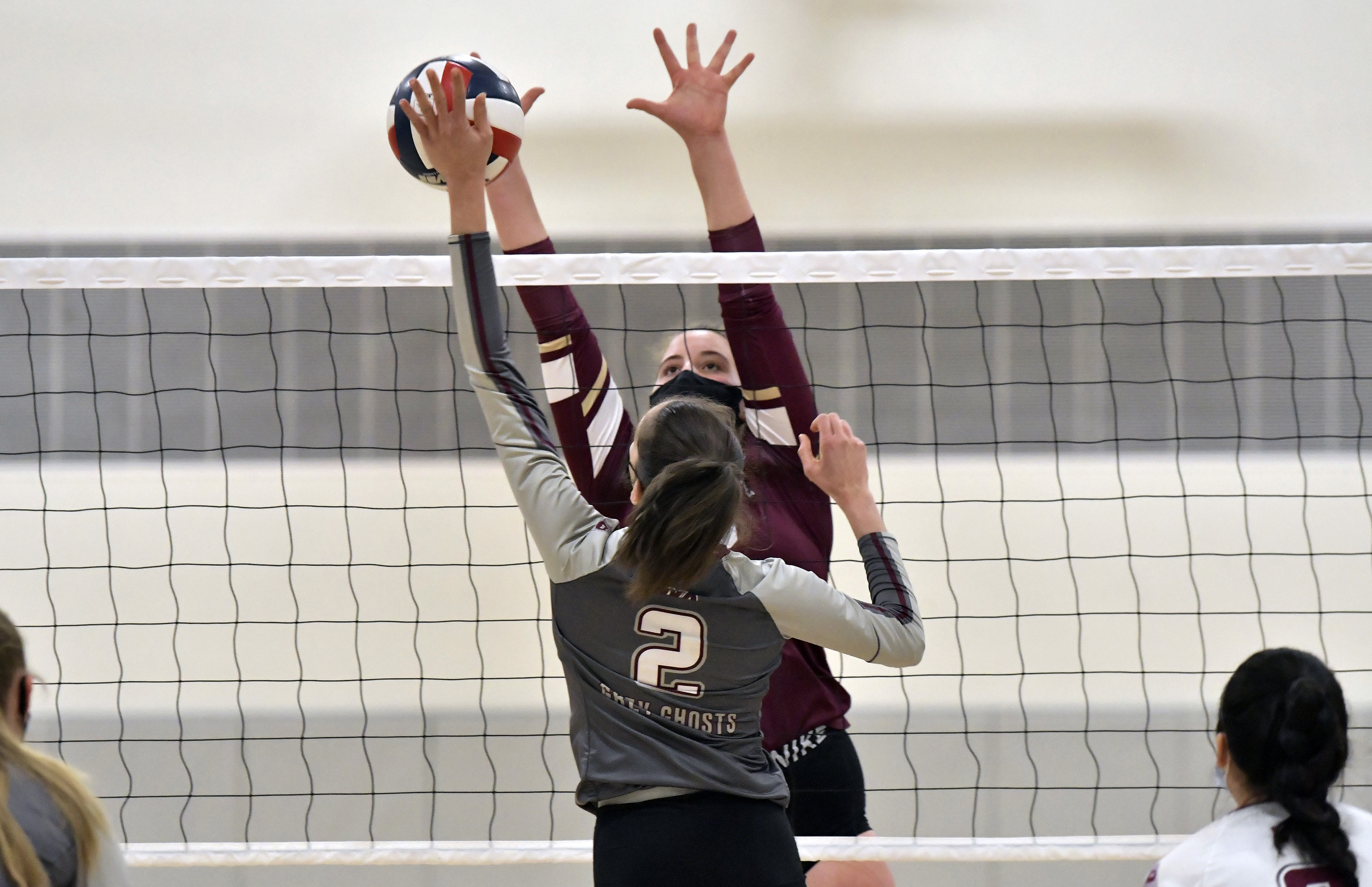 Concord-Carlisle's Lily Sills (23) goes to the next against Westford's Sara Cannuscio (2) in Tuesday's match.