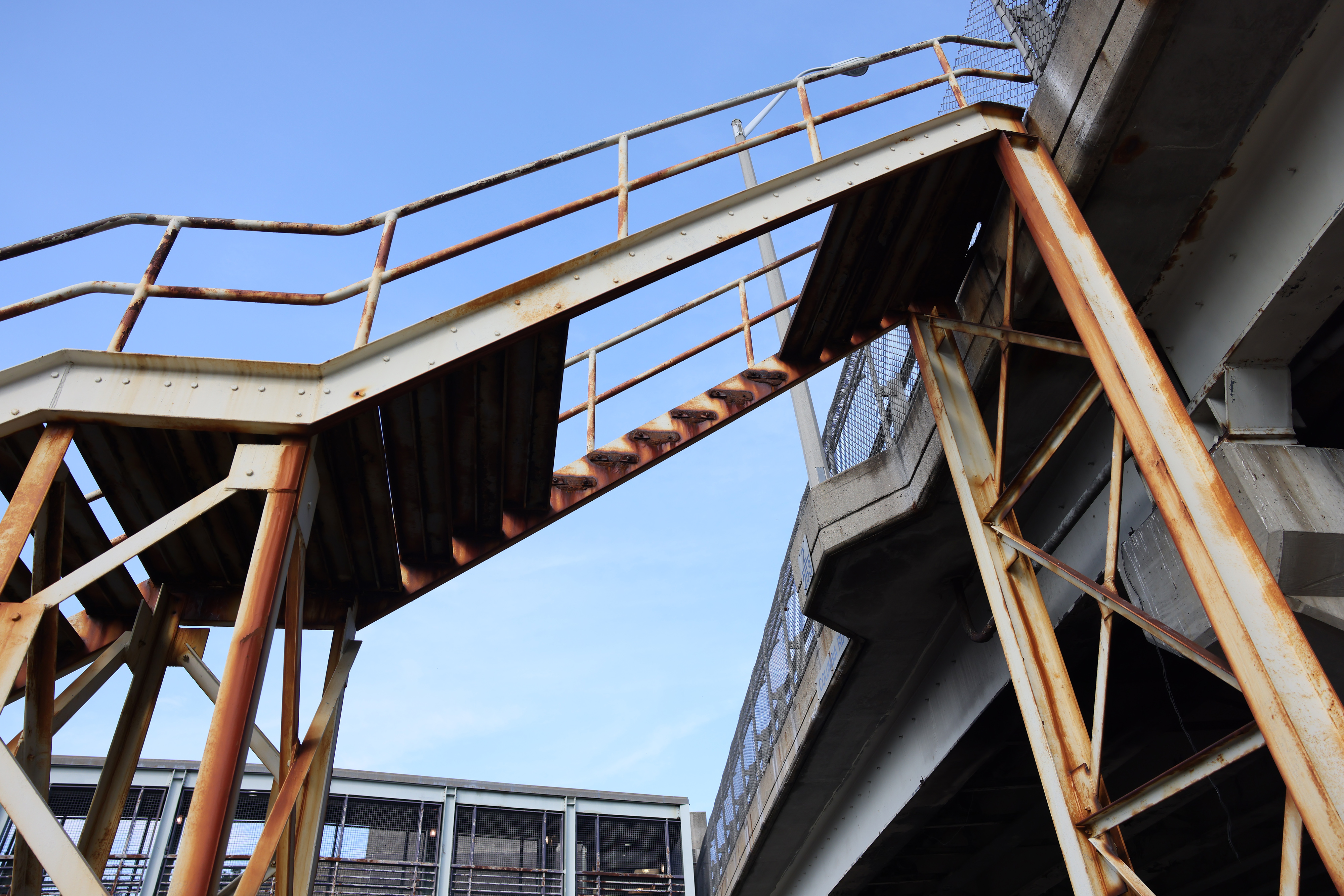 A gap with missing steps is visible on a staircase near the JFK MBTA station, where Dr David K. Jones died.