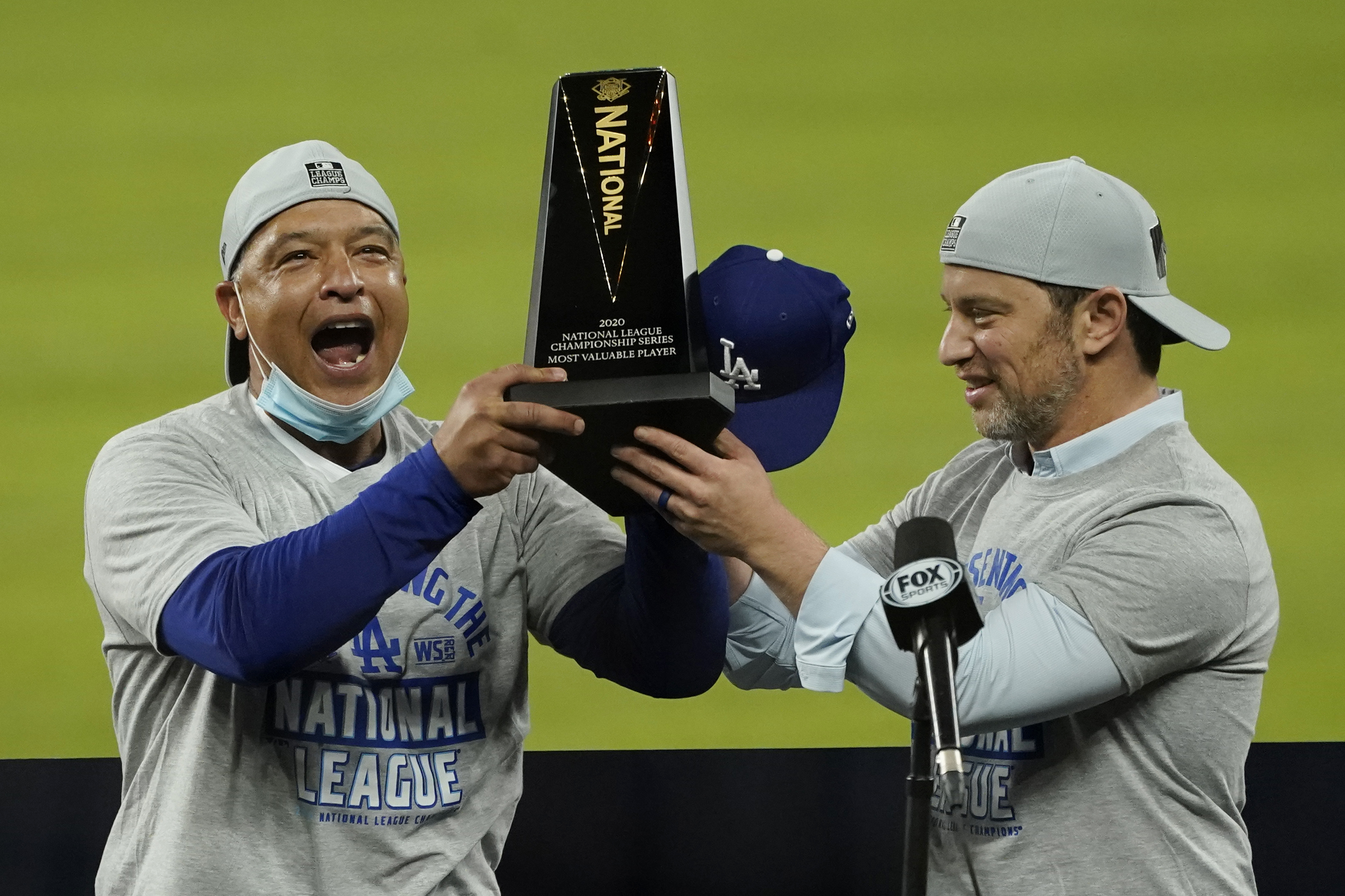 Andrew Friedman (right) has helped build a team for manager Dave Roberts (left) that was capable of making the World Series three of the last four seasons, winning one.