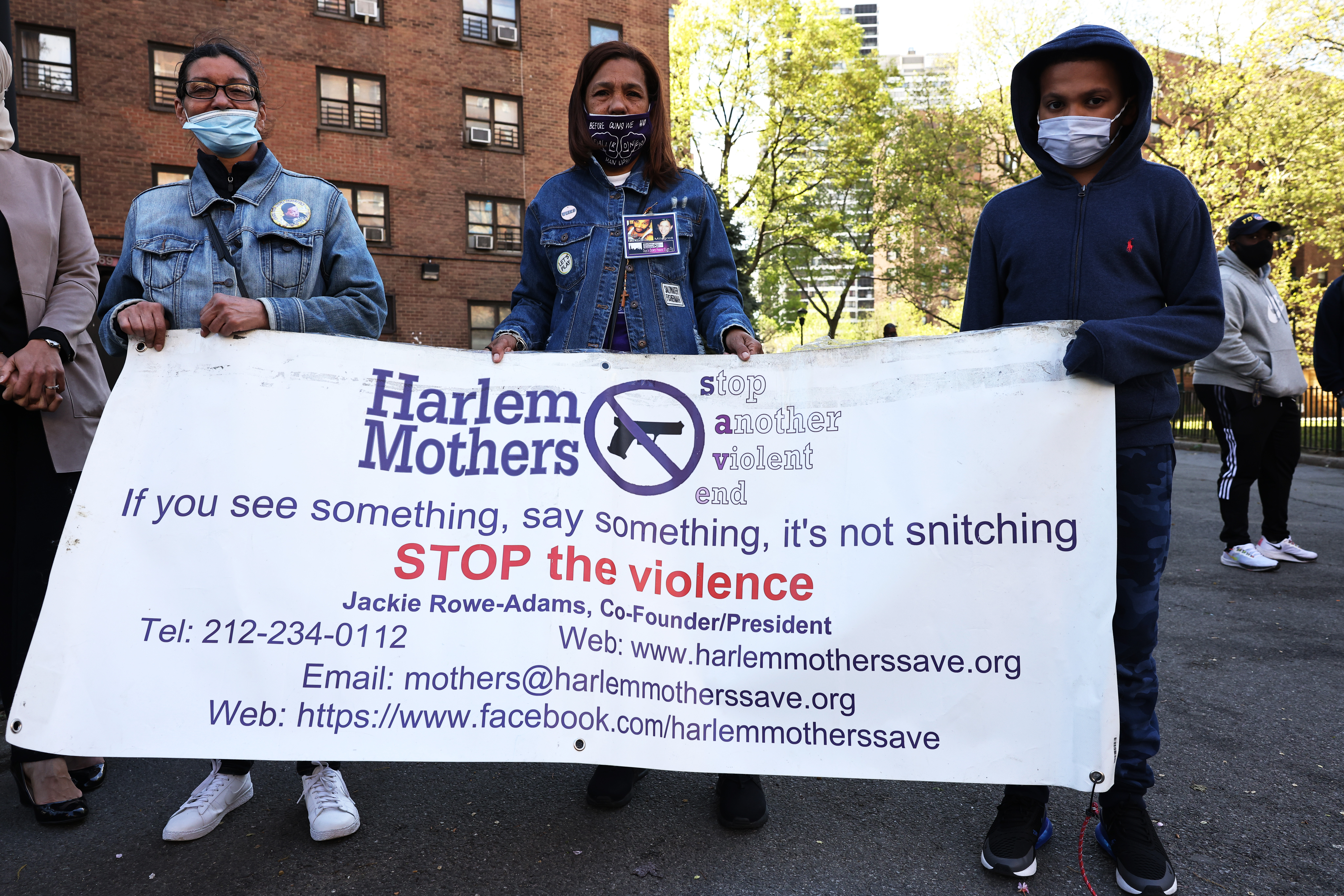 Margie Rodrigues, Milagros Ortega, and Gino Myers, 10, at a peace walk in Harlem, New York City, to denounce the rise of gun violence on April 30.